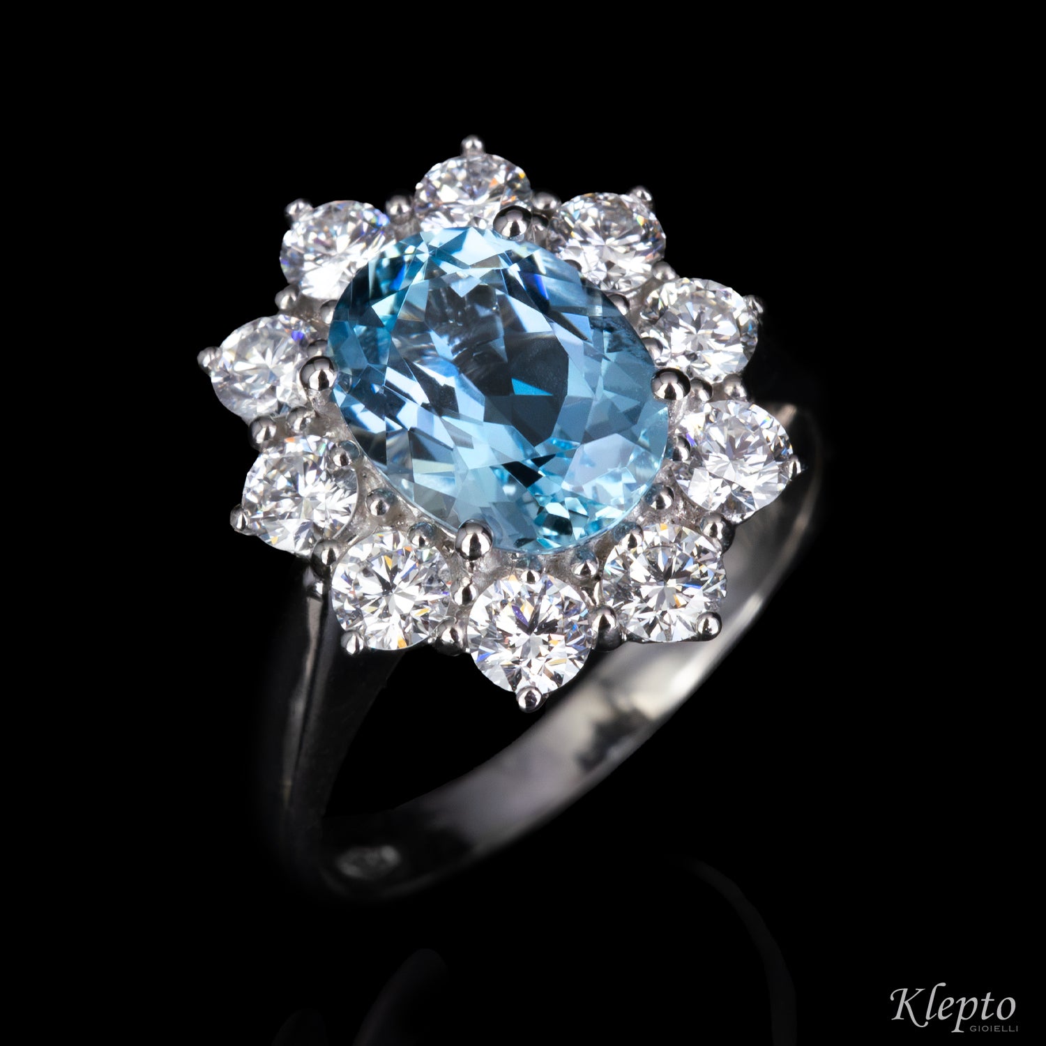Classic white gold ring with Aquamarine and a diamond halo