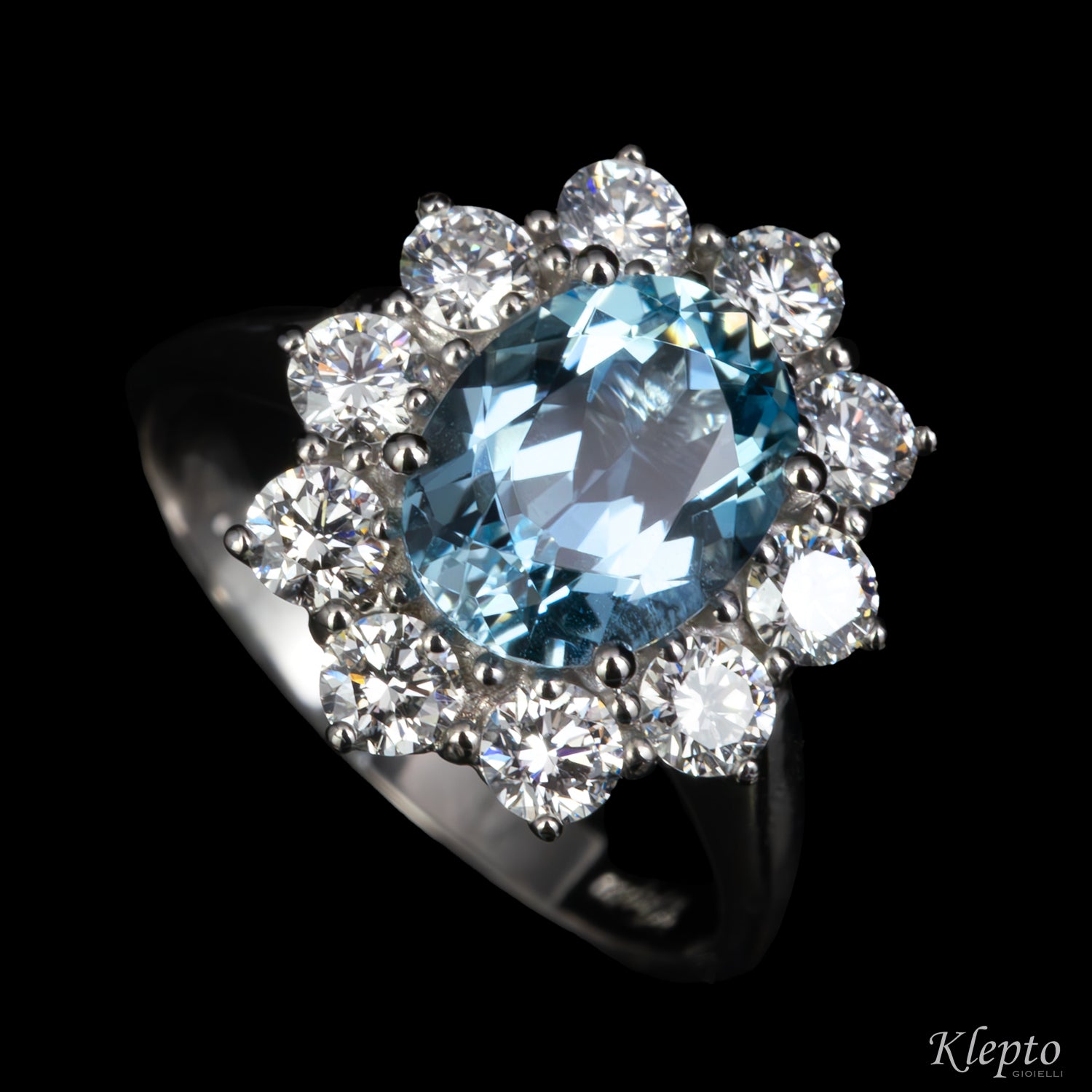 Classic white gold ring with Aquamarine and a diamond halo