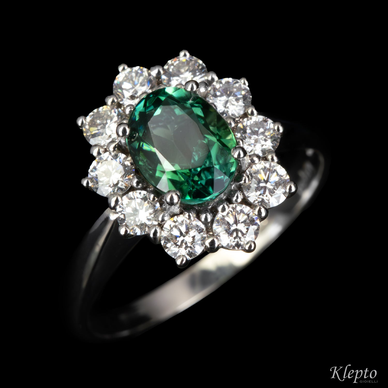 Classic white gold ring with green tourmaline and diamond surround