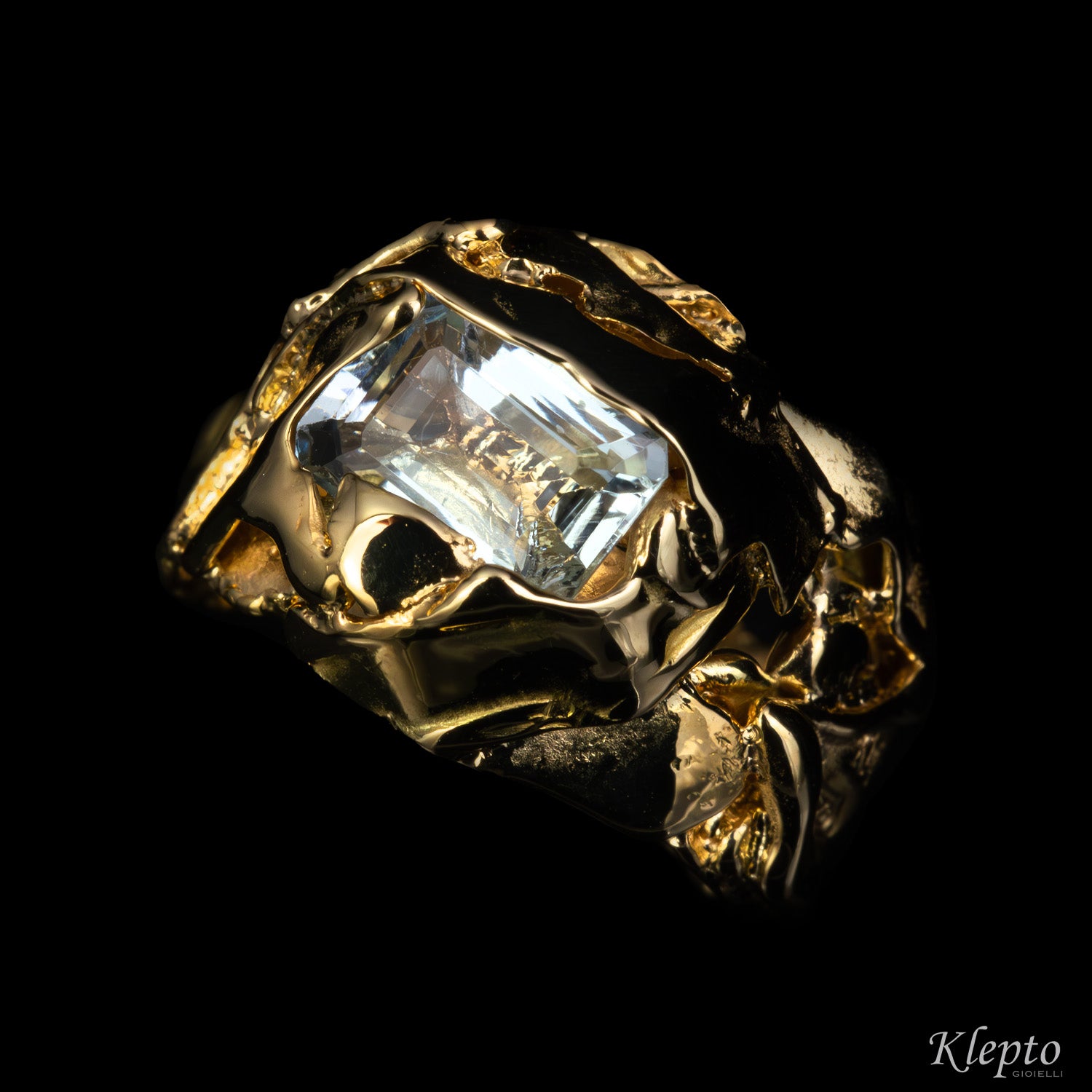 Yellow gold ring cast with flame with Aquamarine