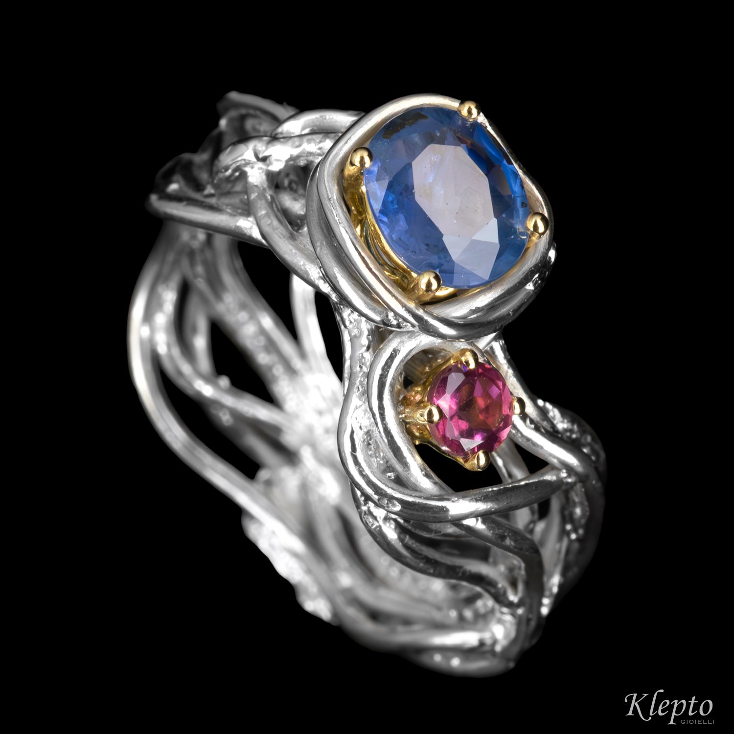 Silver ring by Silnova with blue sapphire, rhodolite, and yellow gold details