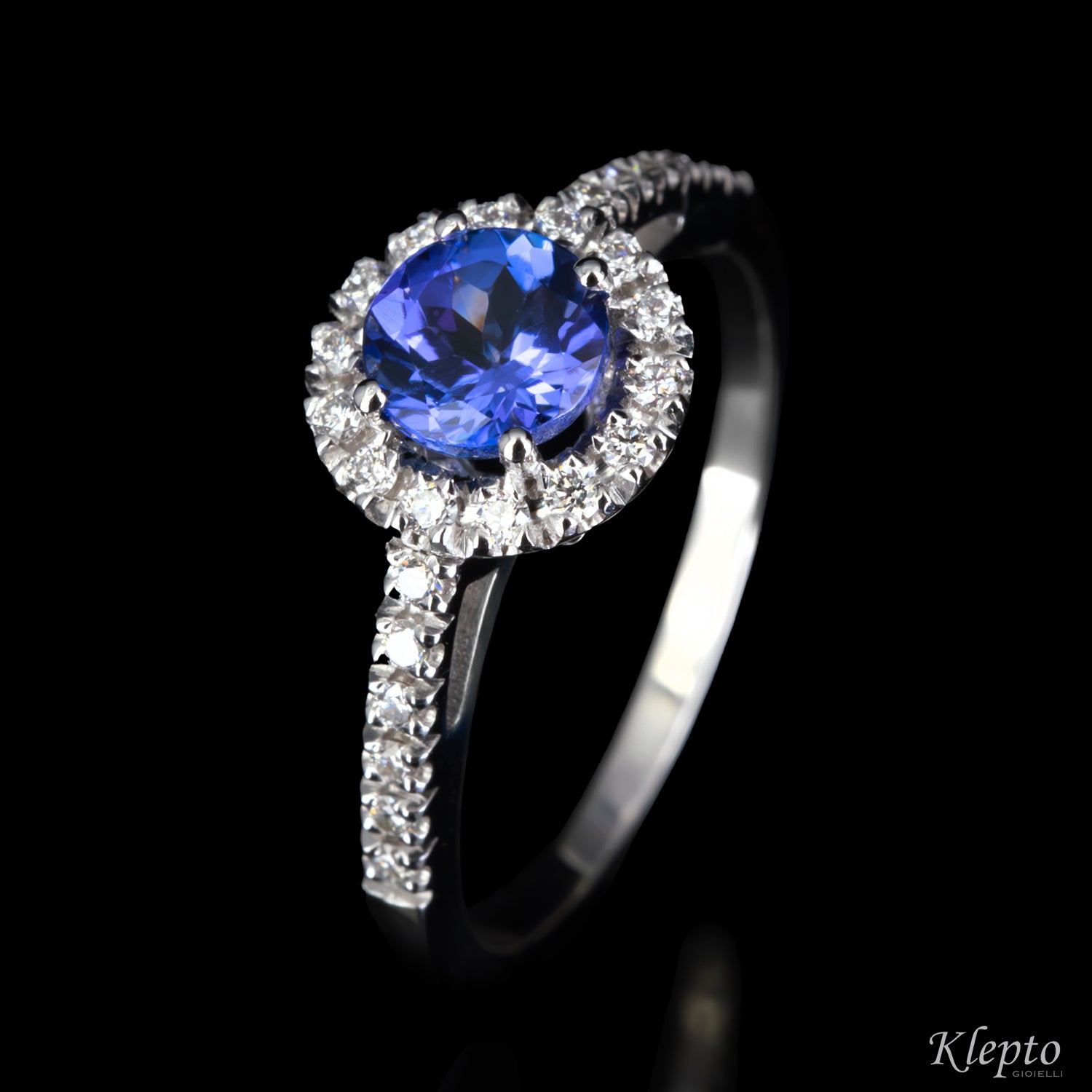 Classic white gold ring with Tanzanite and diamond halo