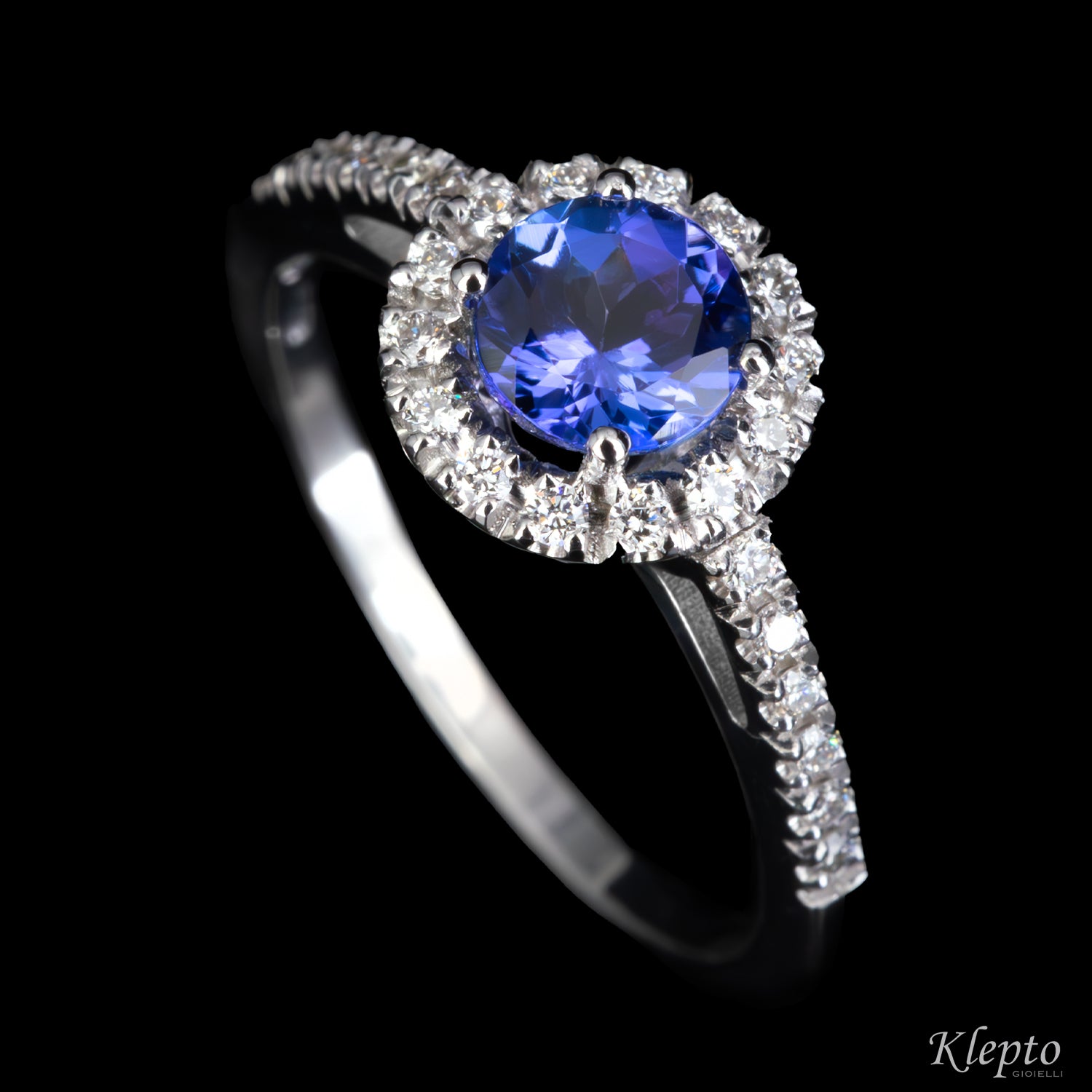 Classic white gold ring with Tanzanite and diamond halo