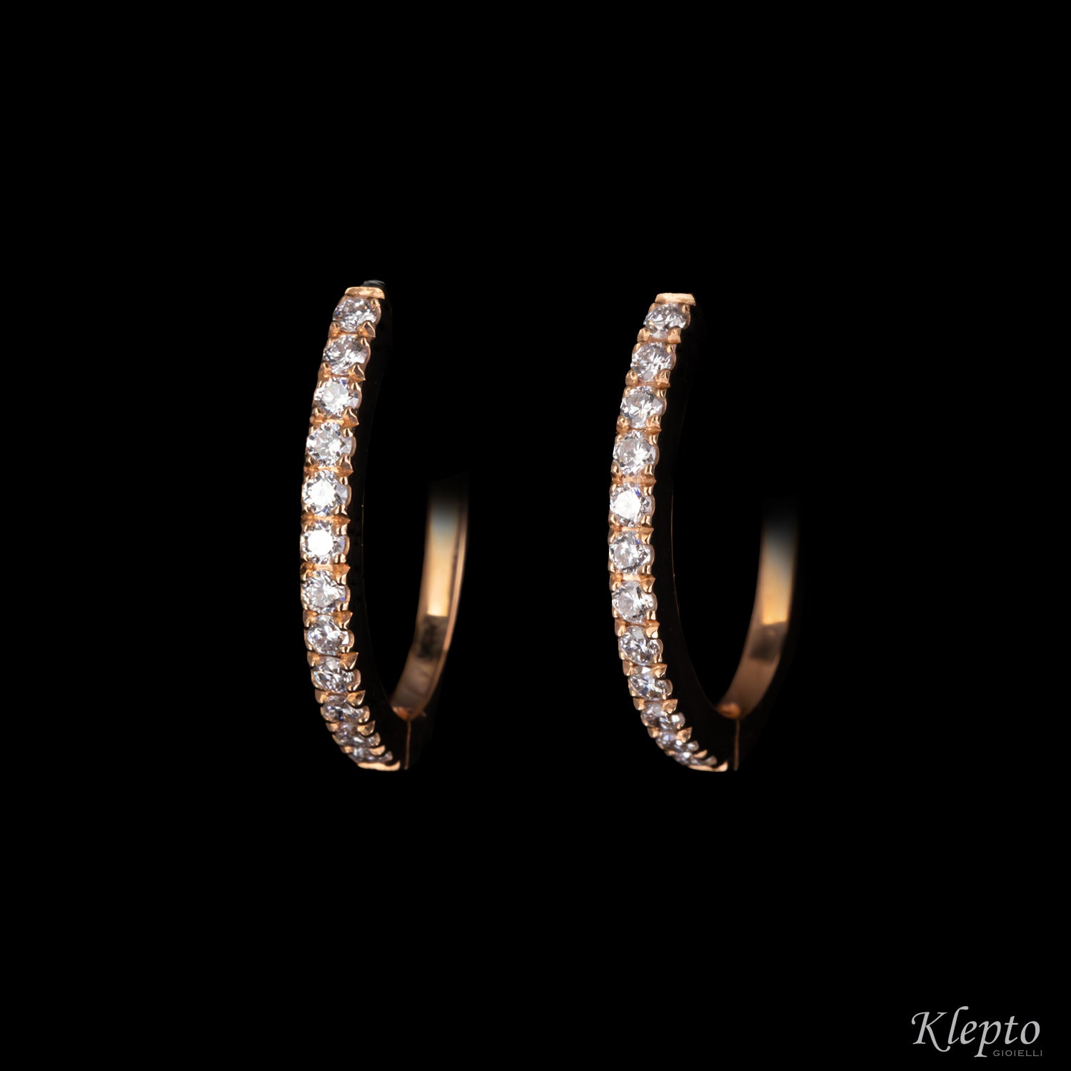 Oval hoop gold earrings with diamonds