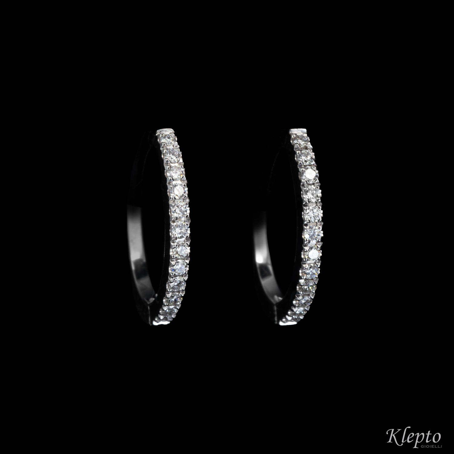 Oval hoop gold earrings with diamonds