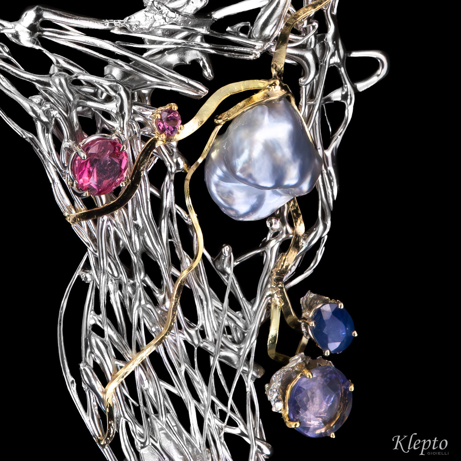 Silver necklace in Silnova® with Keshi pearl, sapphires, tourmaline, rhodolite, and yellow gold details.