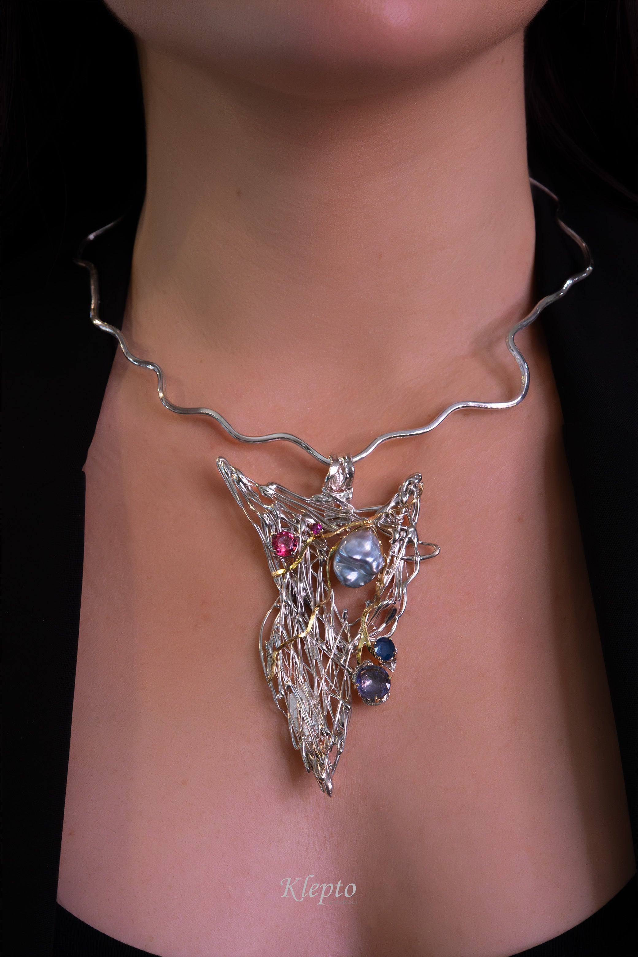 Silver necklace in Silnova® with Keshi pearl, sapphires, tourmaline, rhodolite, and yellow gold details.