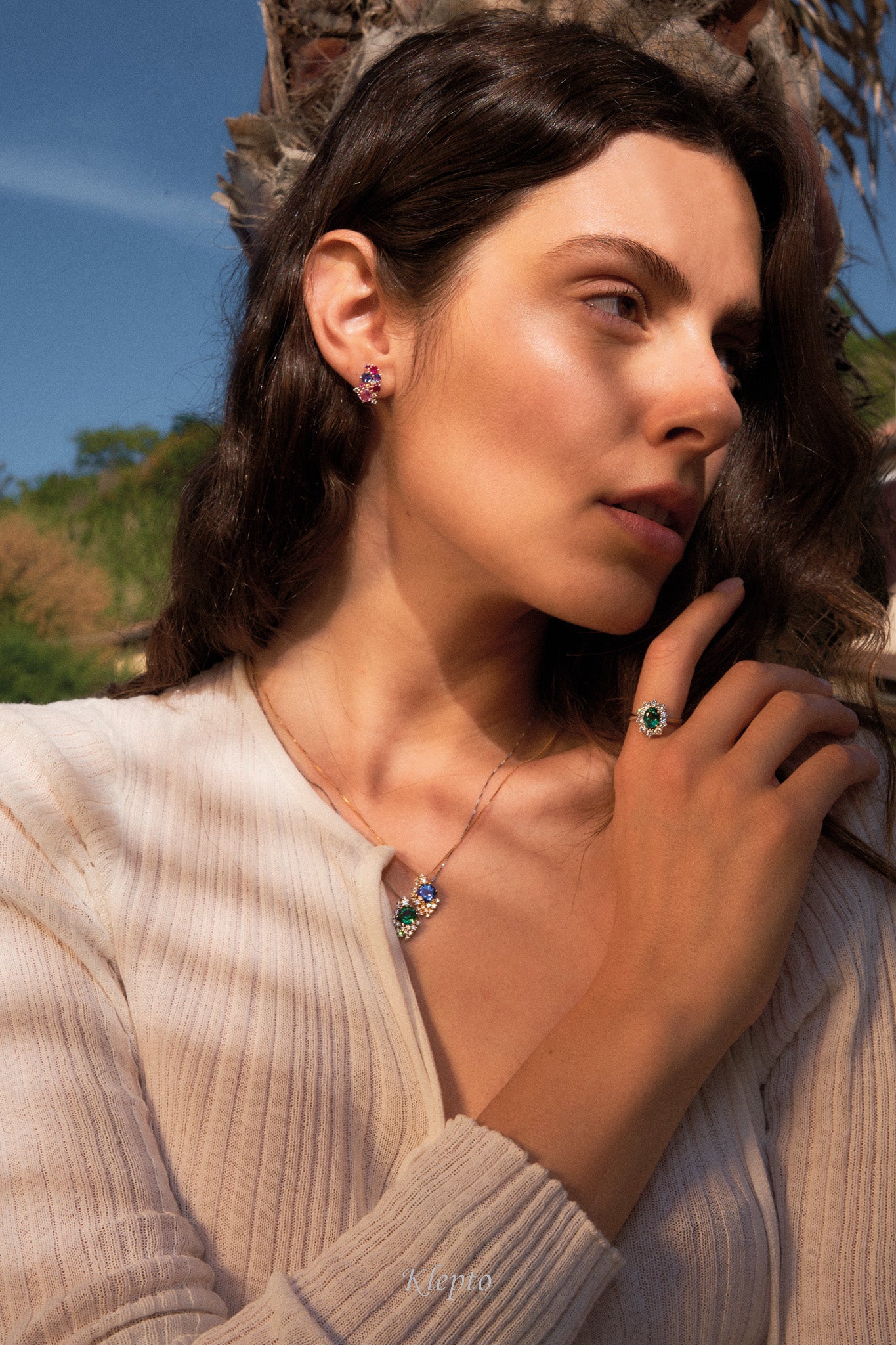 Classic white gold ring with green tourmaline and diamond surround