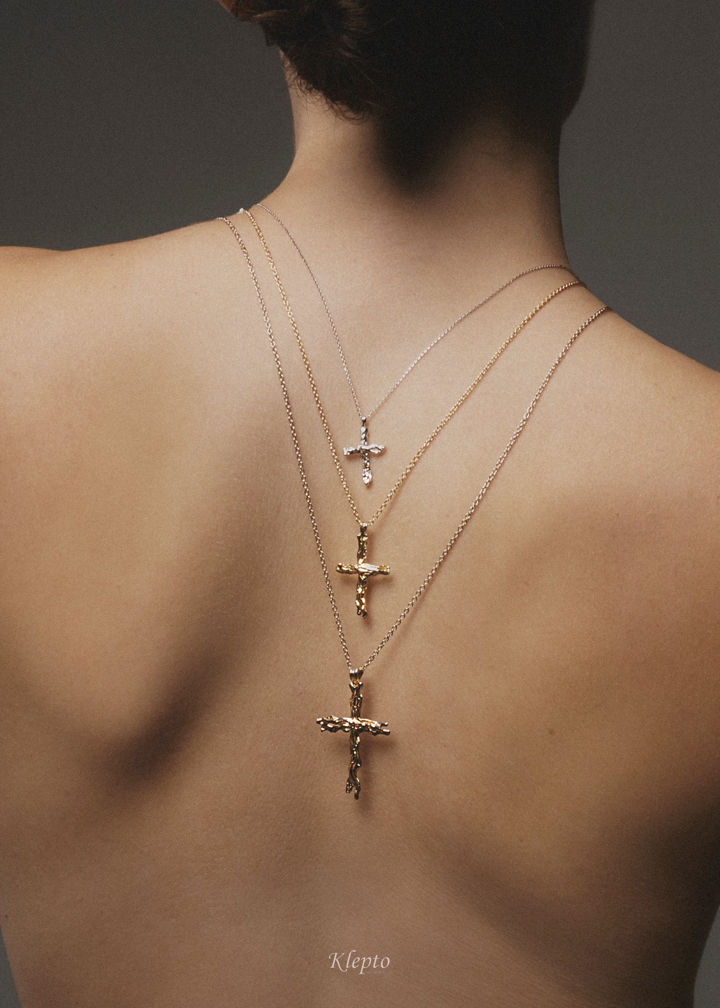 Flame-fused gold cross pendant