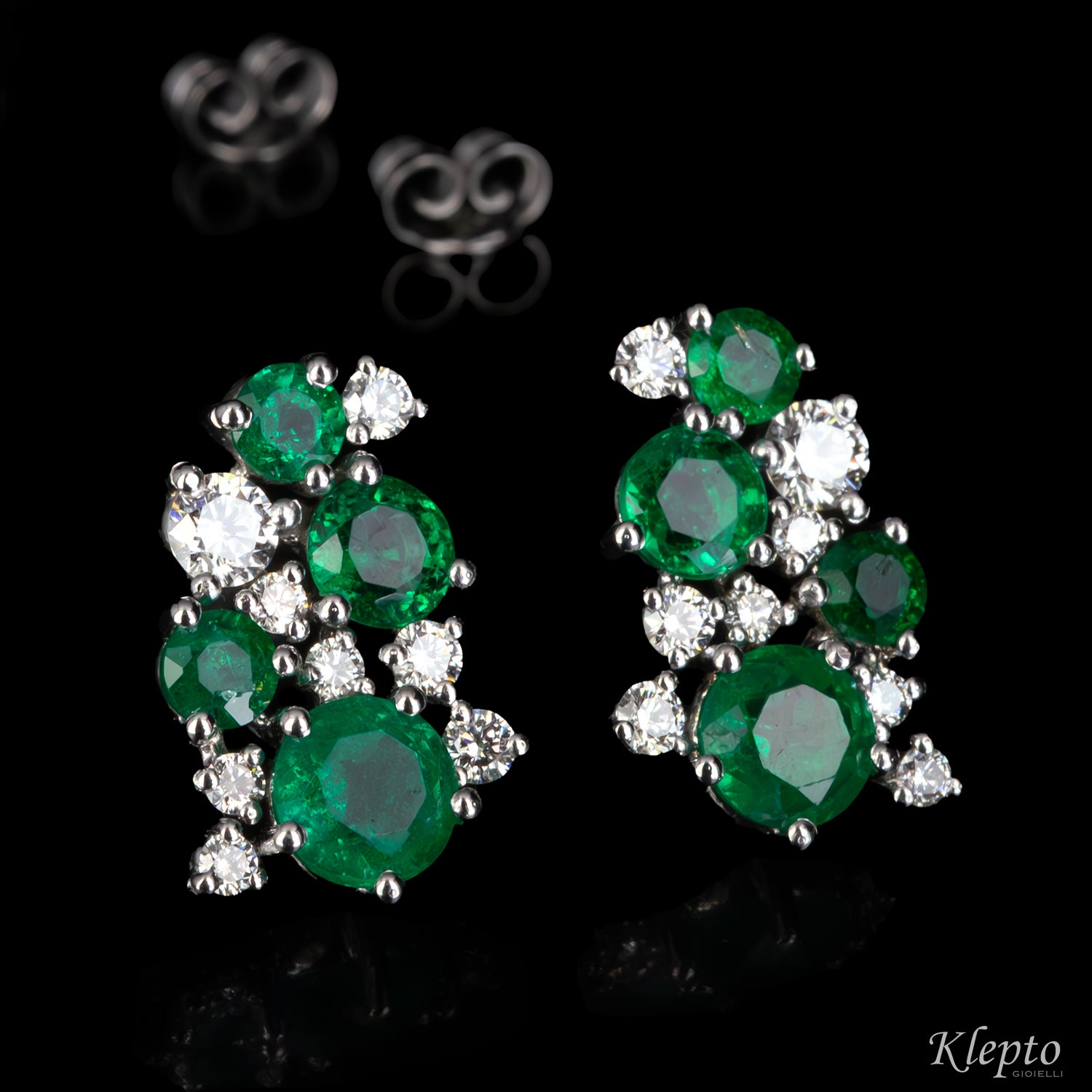 White gold earrings with emeralds and diamonds