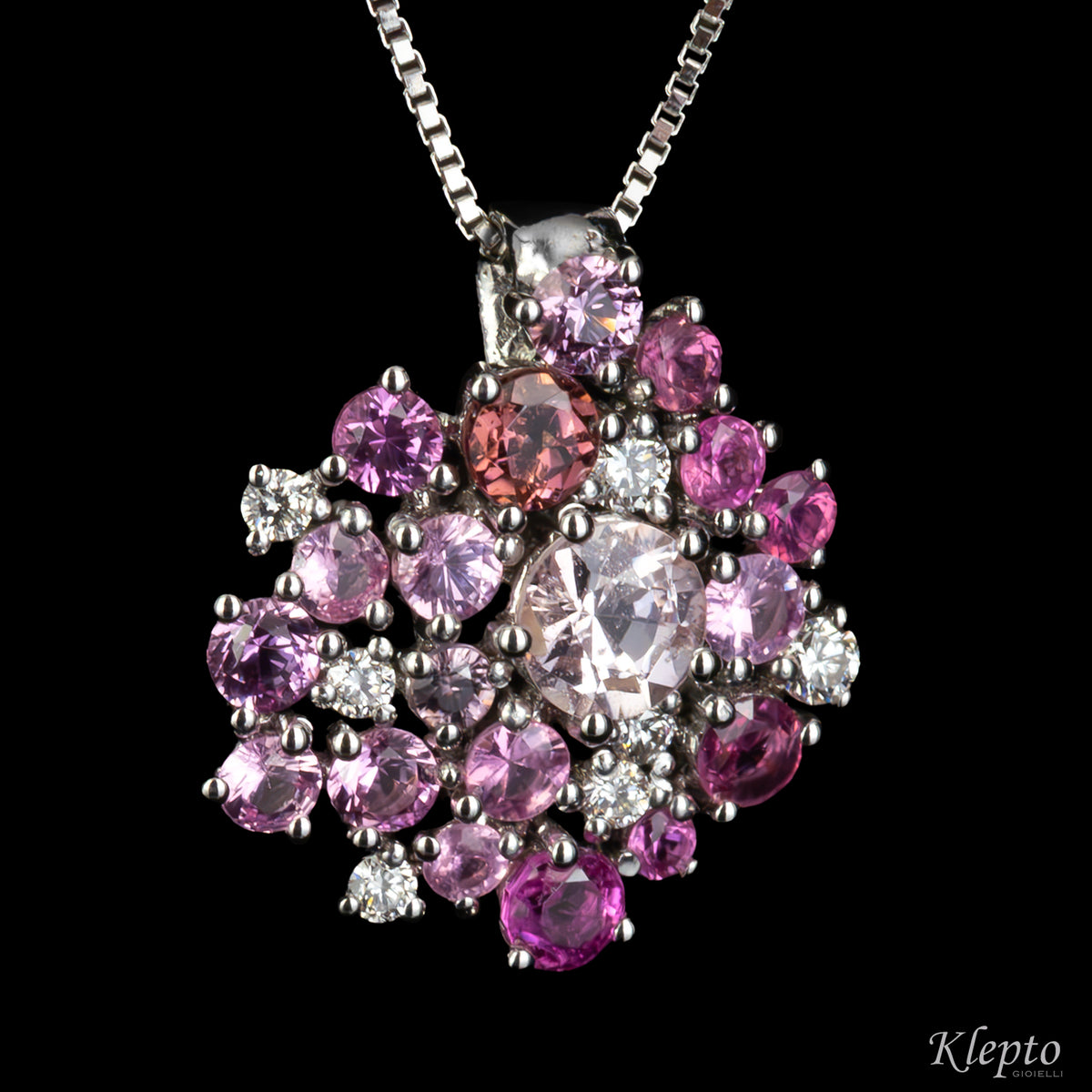 White gold pendant with pink sapphires, rhodolites and diamonds