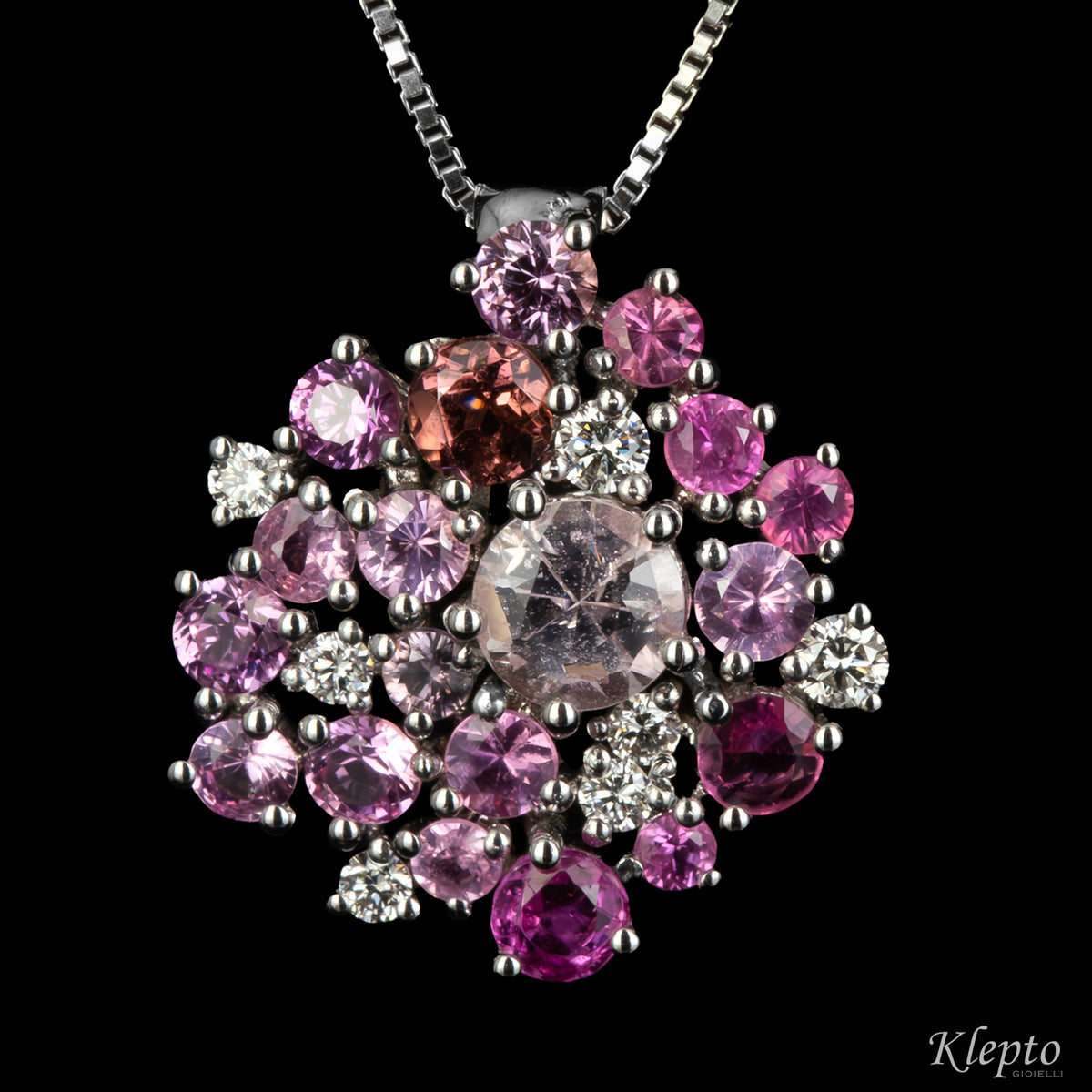 White gold pendant with pink sapphires, rhodolites and diamonds