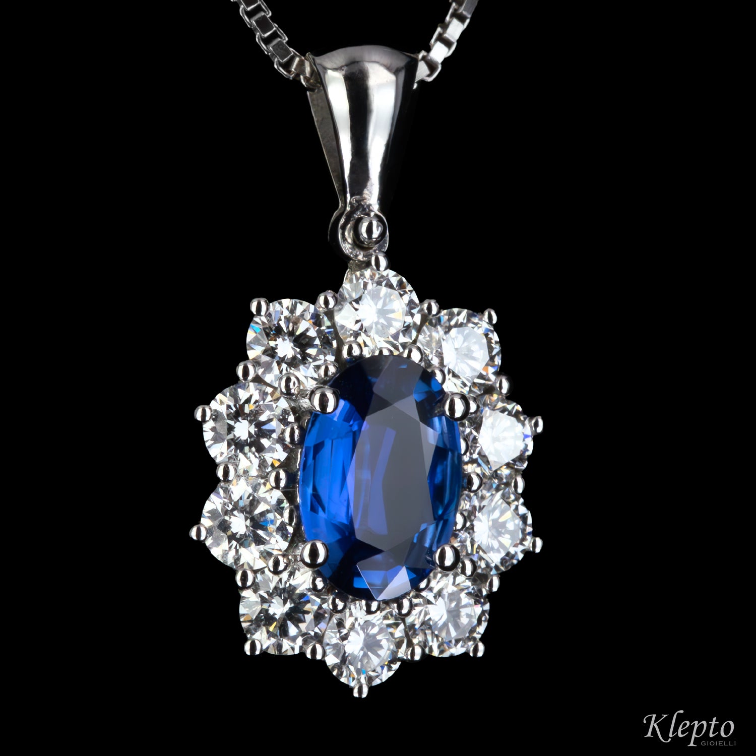 White gold pendant with Sapphire and diamond surround