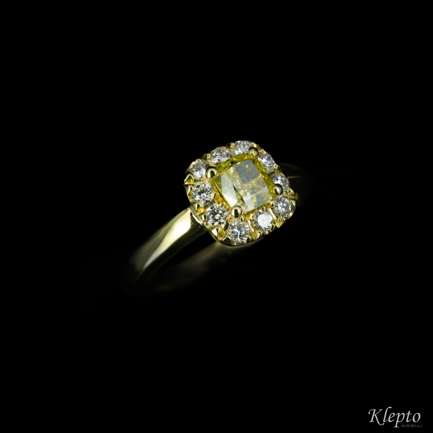 Classic yellow gold ring with Fancy yellow Diamond and diamond surround