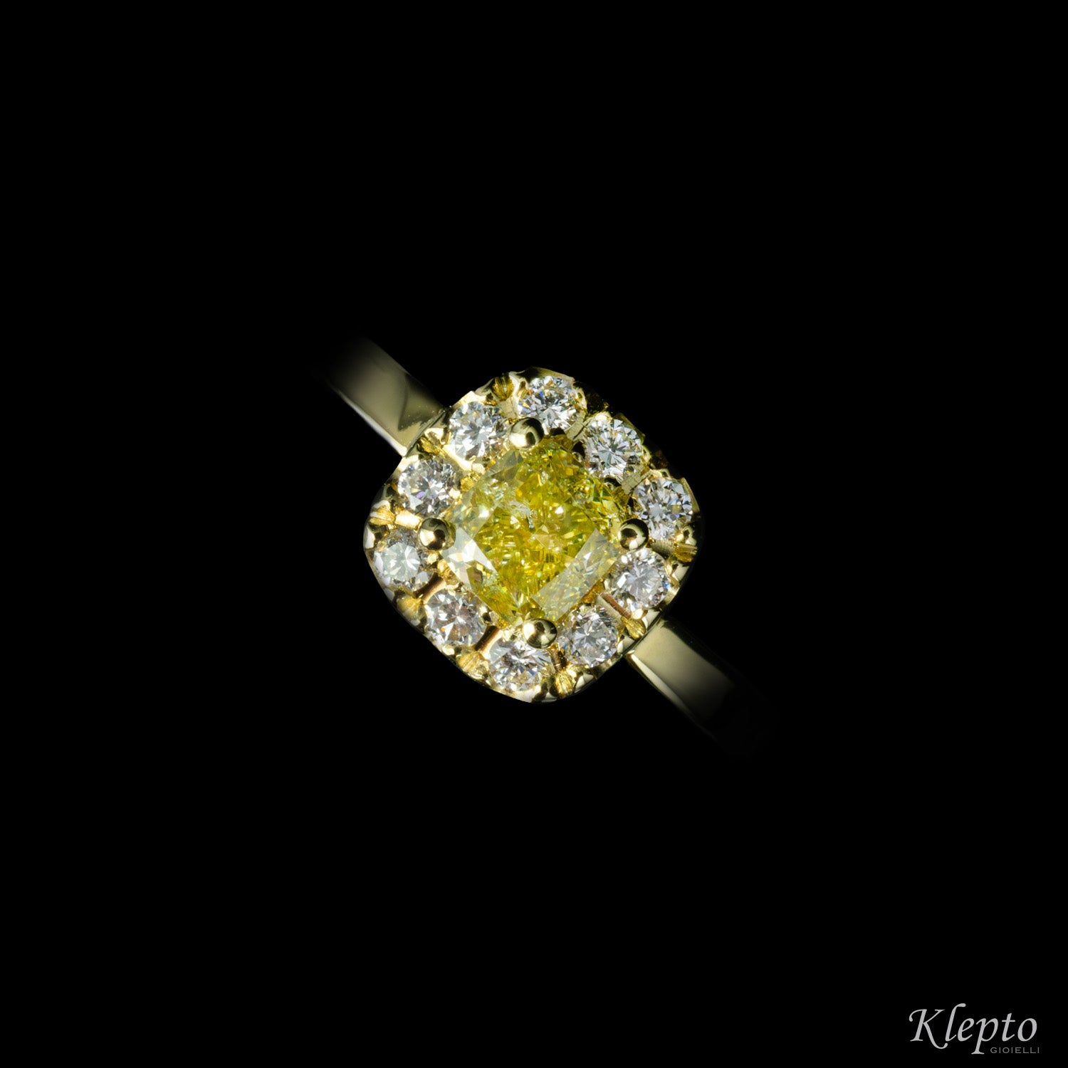 Classic yellow gold ring with Fancy yellow Diamond and diamond surround