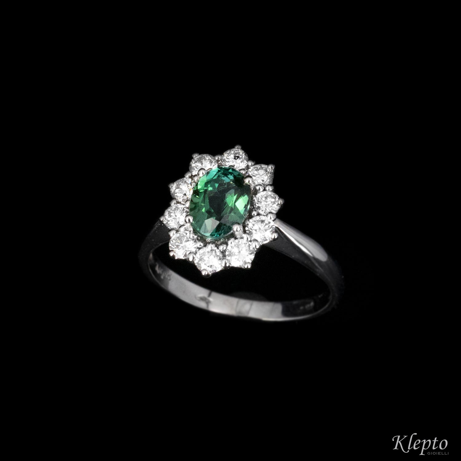 Classic white gold ring with green tourmaline and diamond surround