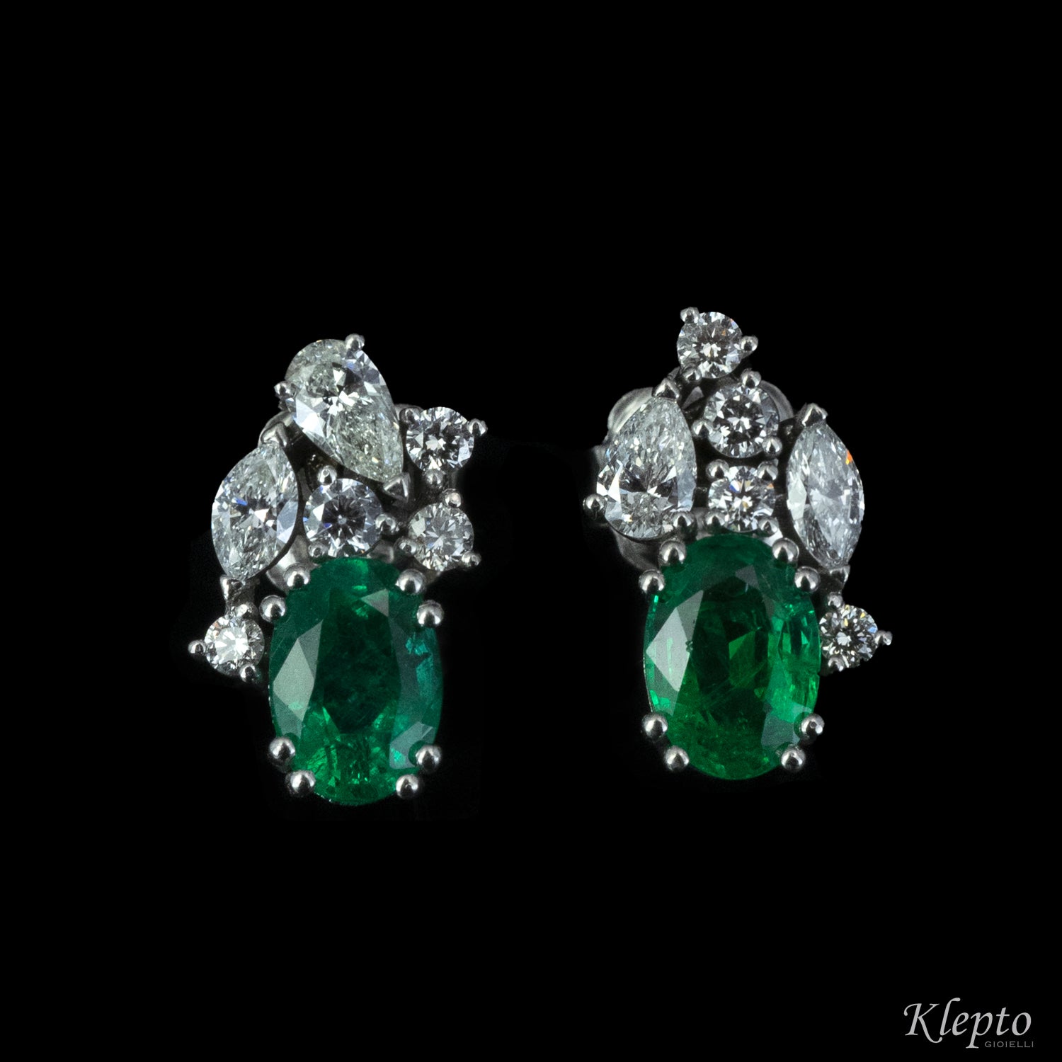 White gold earrings with emeralds and fancy cut diamonds