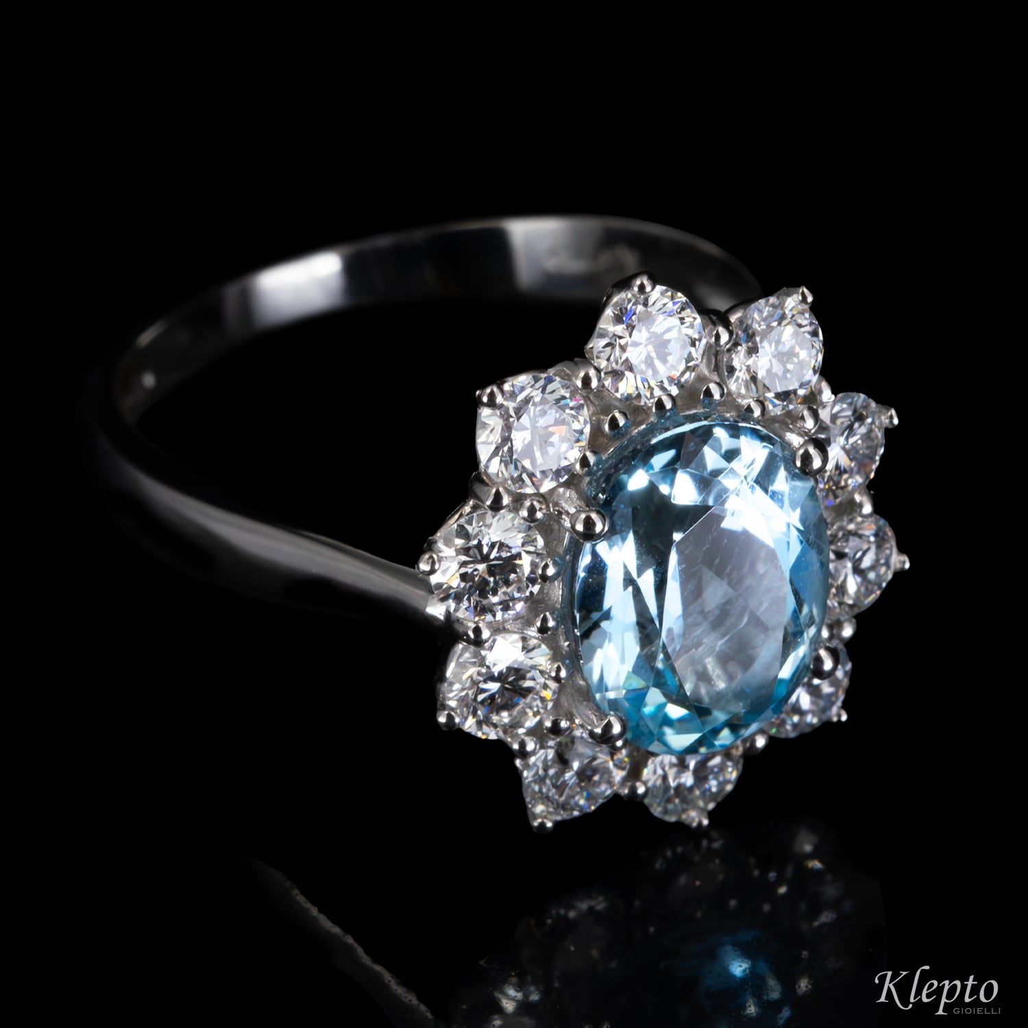 Classic white gold ring with Aquamarine and a diamond halo