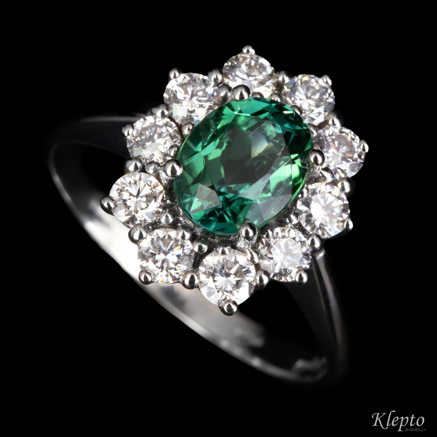 Classic white gold ring with green tourmaline and diamond surround