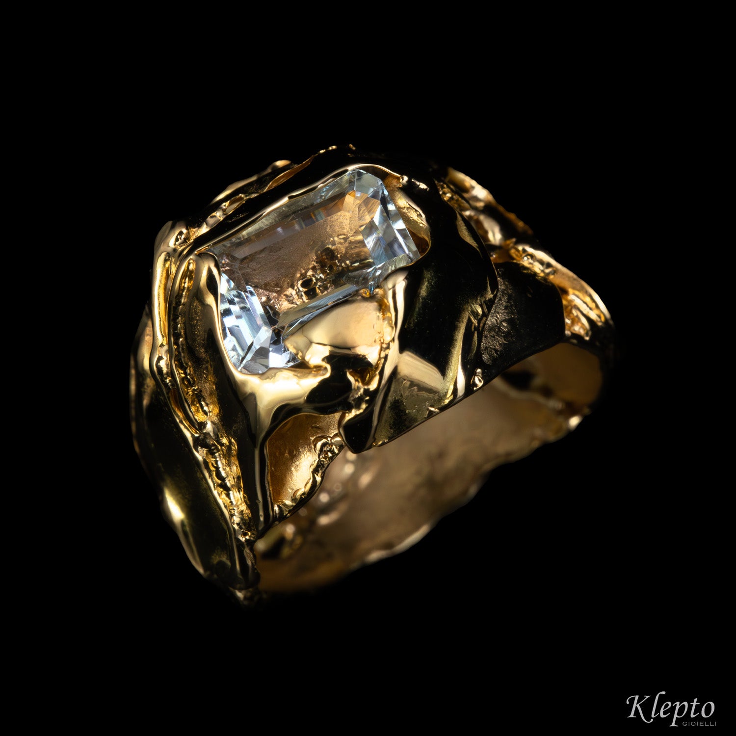 Yellow gold ring cast with flame with Aquamarine