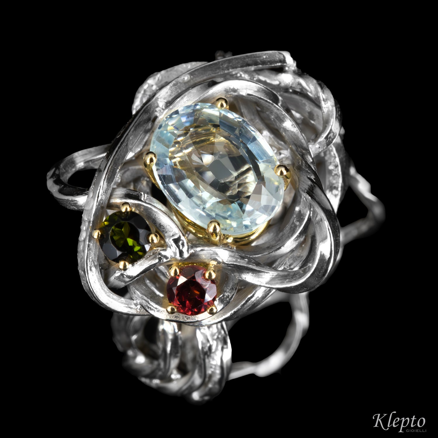Silver ring by Silnova with aquamarine, tourmaline, rhodolite details in yellow gold