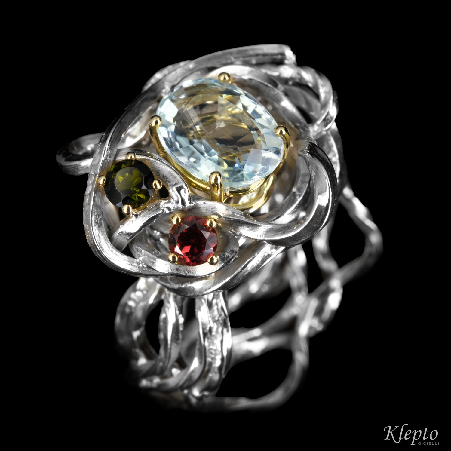 Silver ring by Silnova with aquamarine, tourmaline, rhodolite details in yellow gold