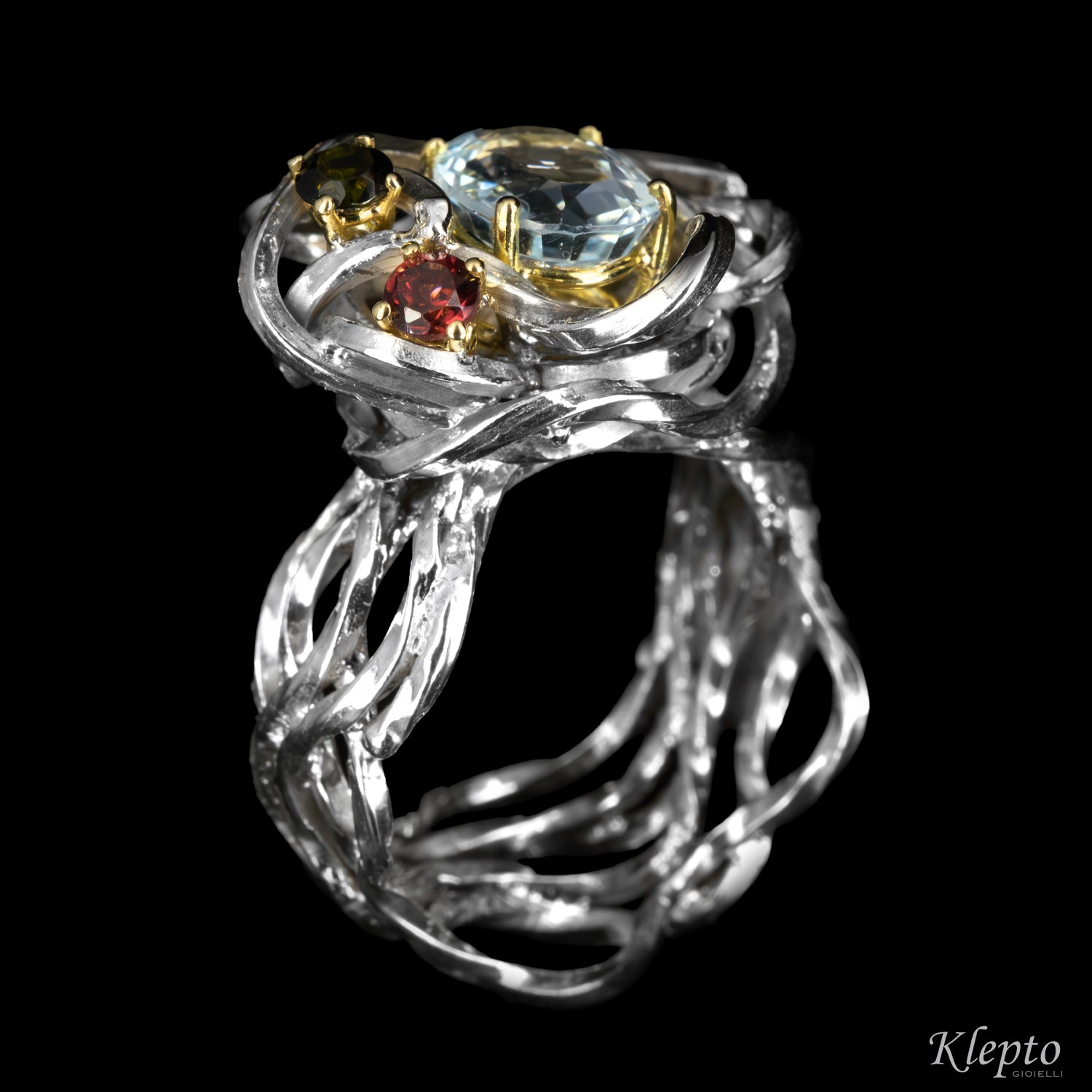 Silver ring by Silnova with aquamarine, tourmaline, rhodolite details in yellow gold