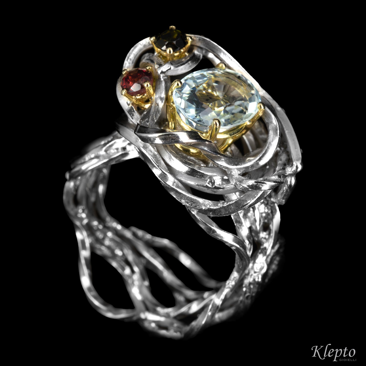 Silver ring by Silnova with aquamarine, tourmaline, rhodolite details in yellow gold