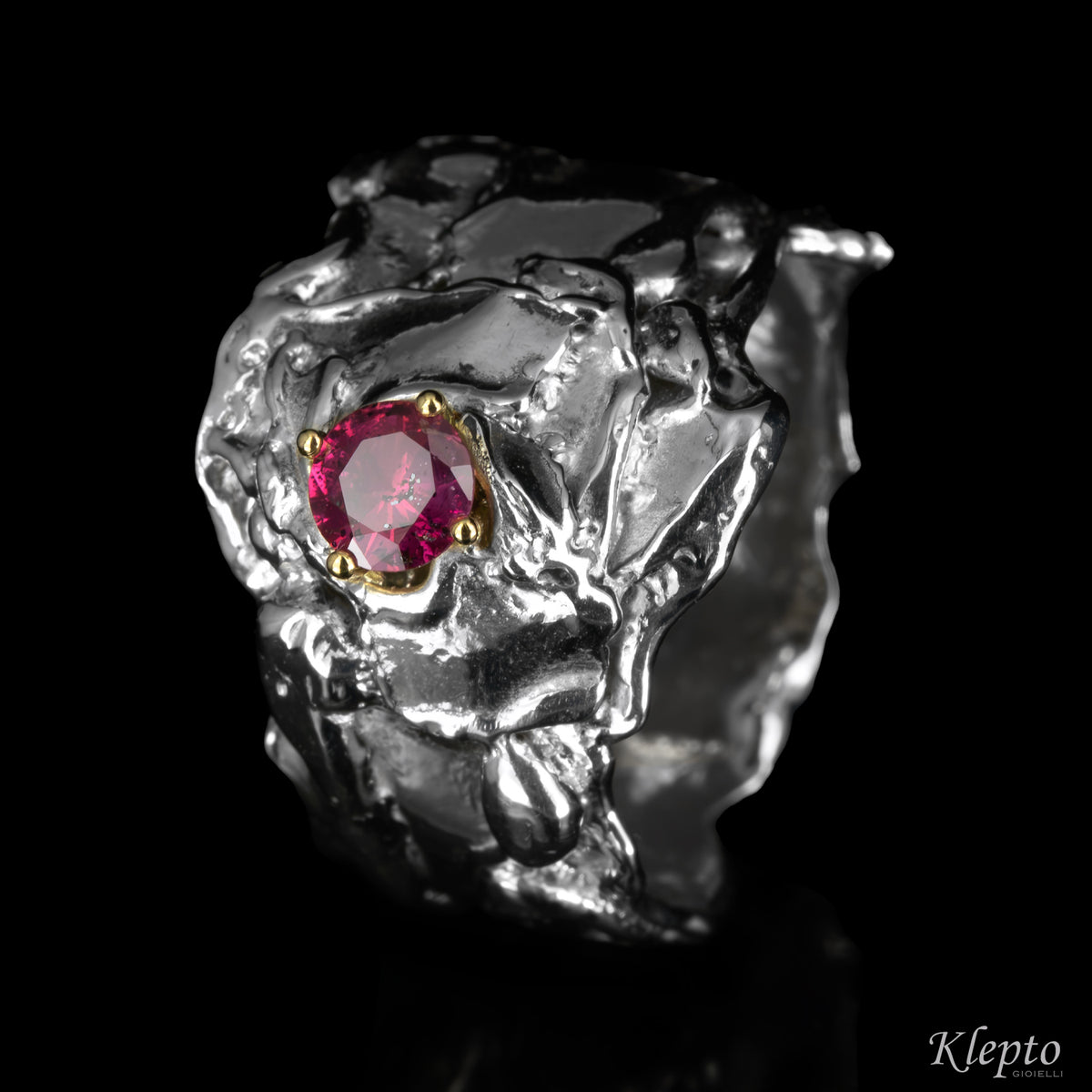 Silnova® silver ring with magenta sapphire and yellow gold details