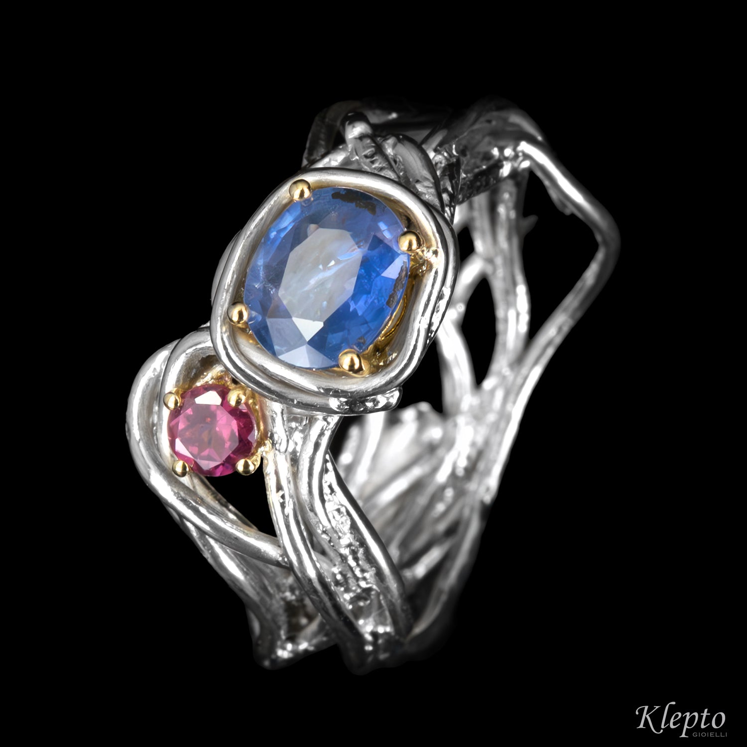 Silver ring by Silnova with blue sapphire, rhodolite, and yellow gold details