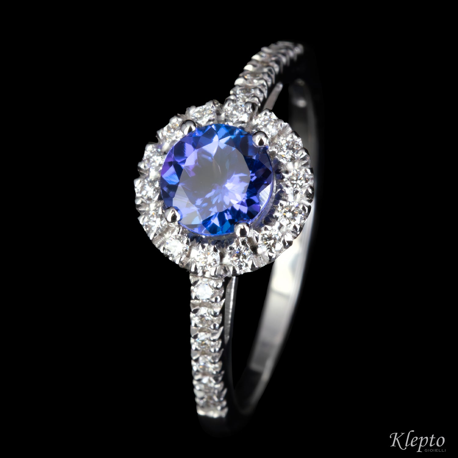 Classic white gold ring with Tanzanite and diamond halo