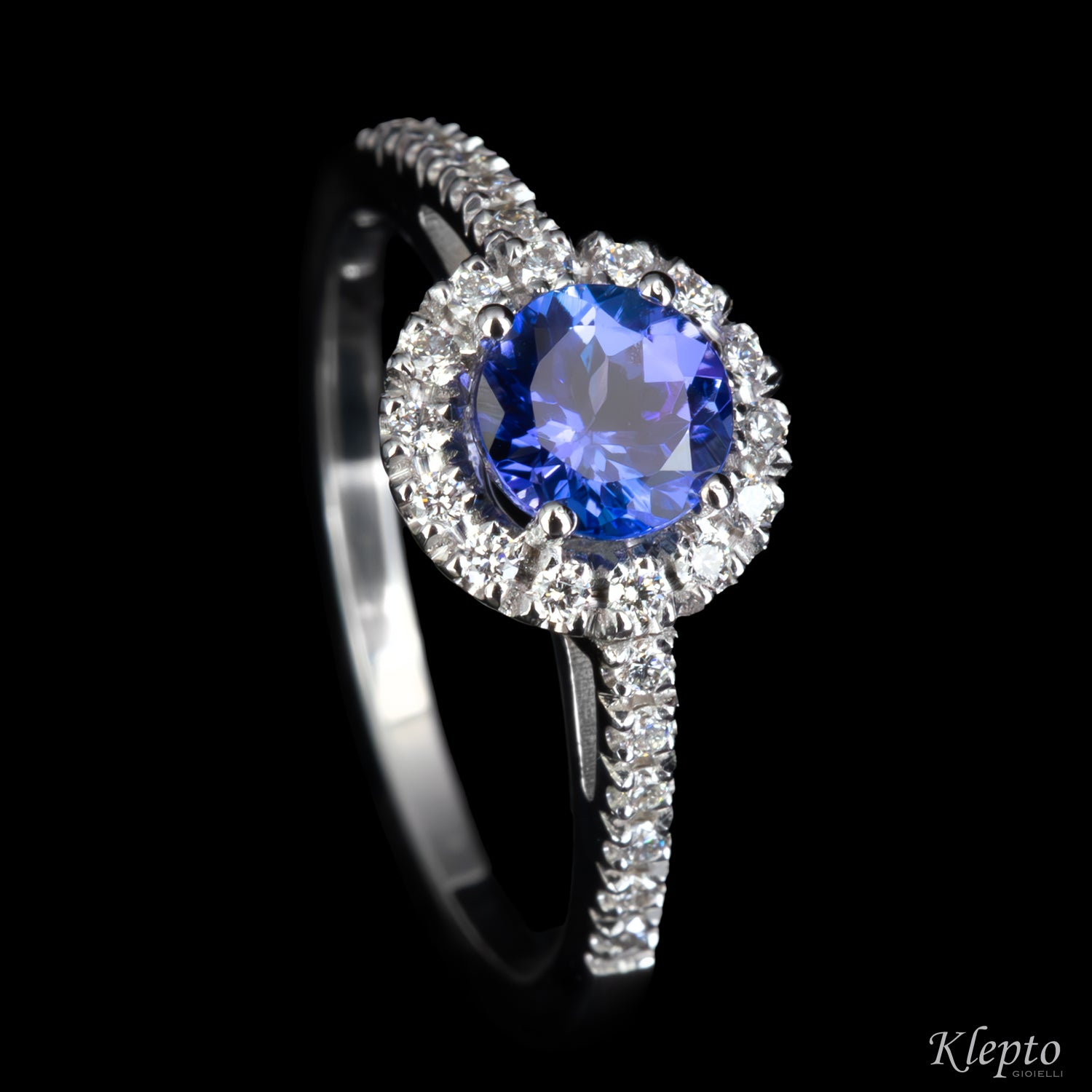 Classic white gold ring with Tanzanite and diamond halo