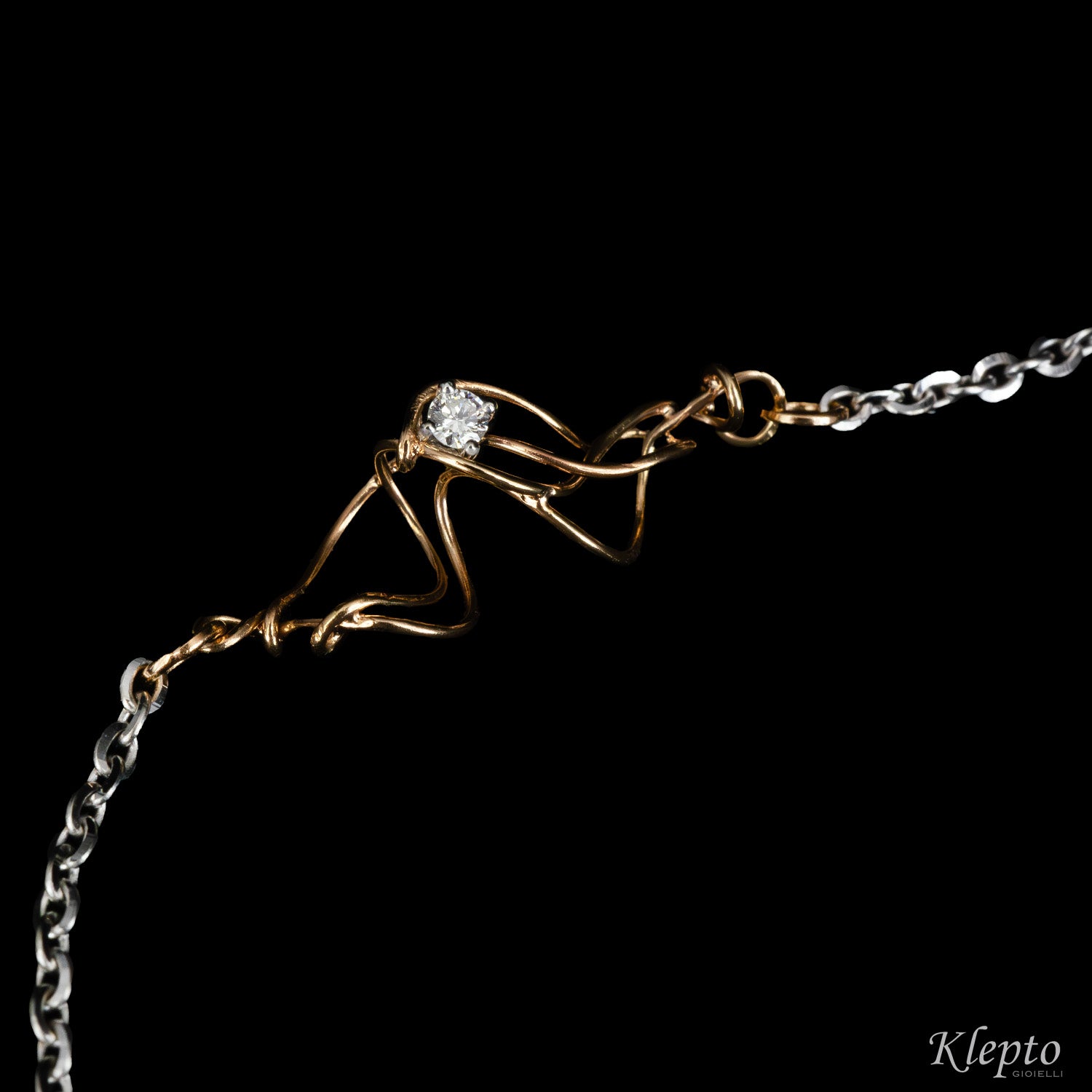 White gold bracelet with diamond and rose gold knot