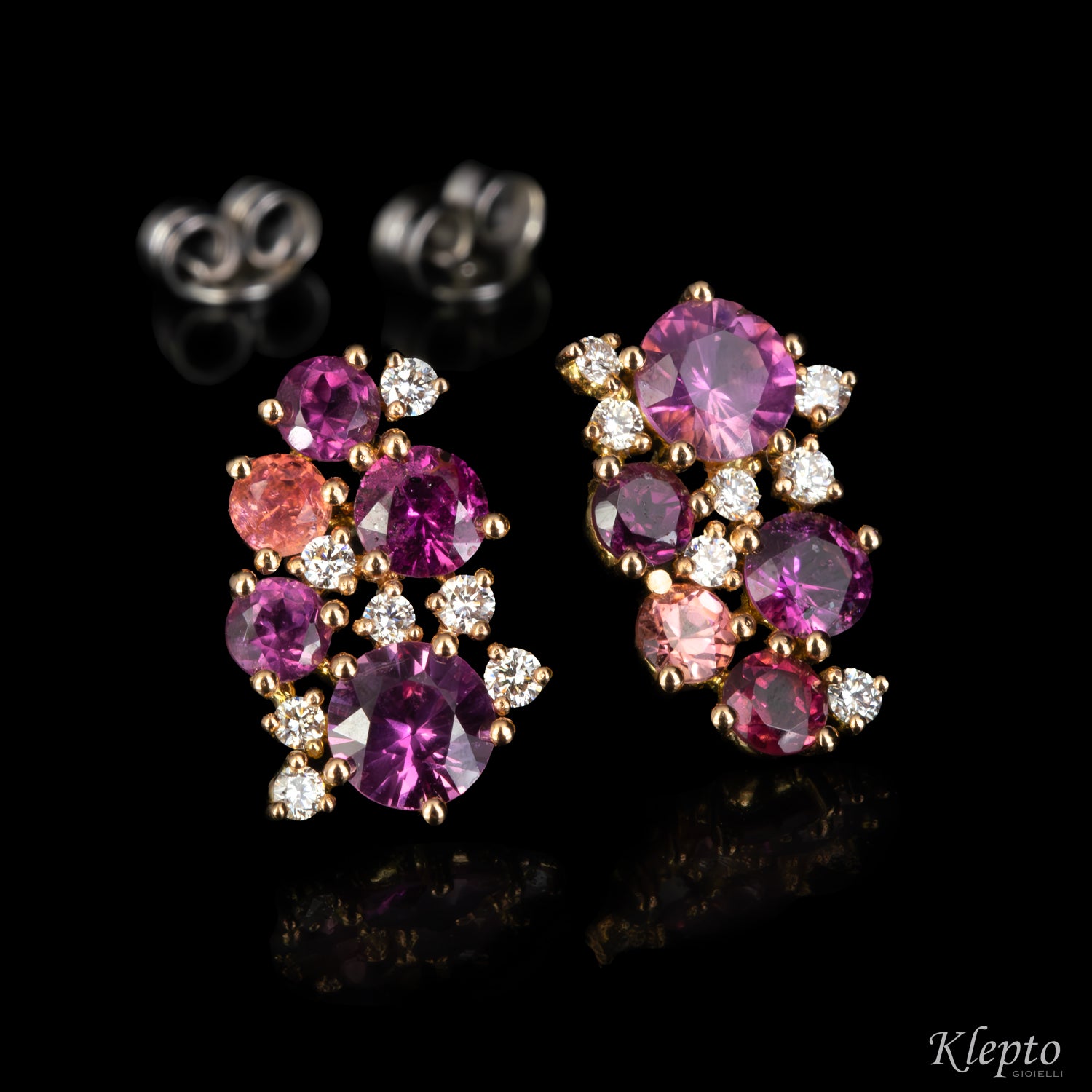 Rose and white gold earrings with pink sapphires, rhodolites, pink tourmalines, and diamonds