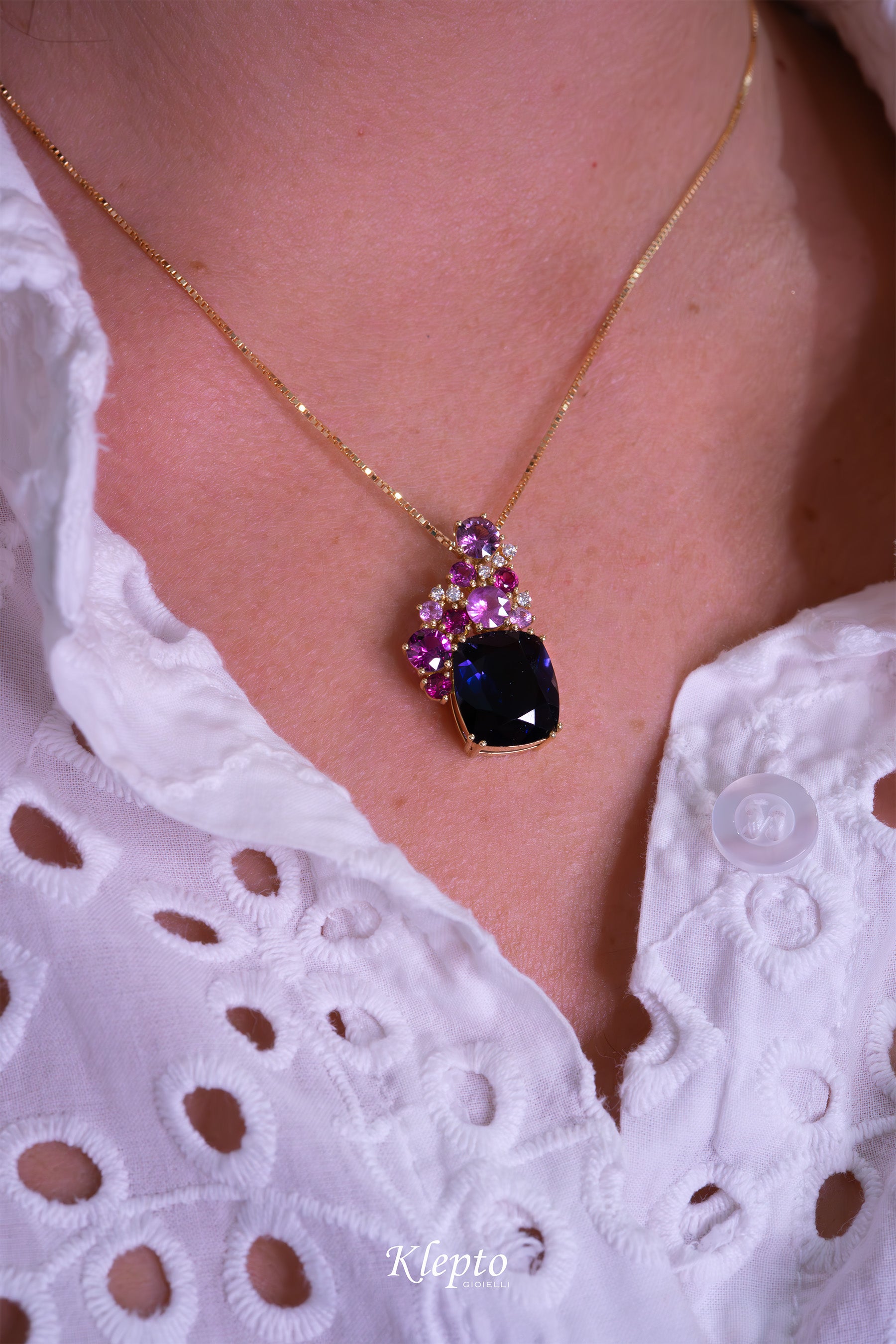 Yellow gold pendant with Iolite, Pink Sapphires, Rhodolites, and Diamonds