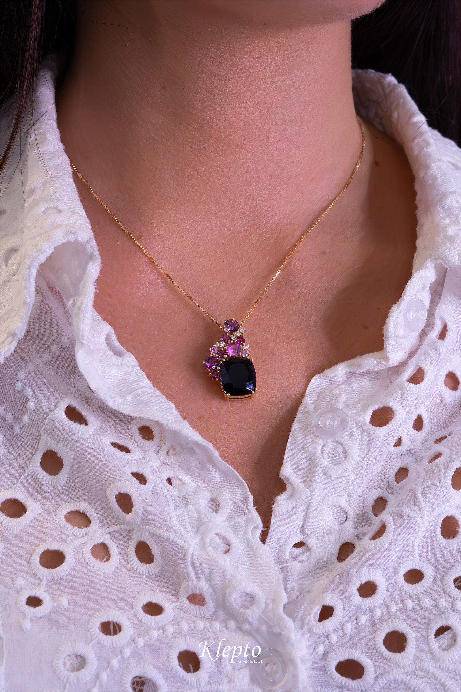 Yellow gold pendant with Iolite, Pink Sapphires, Rhodolites, and Diamonds