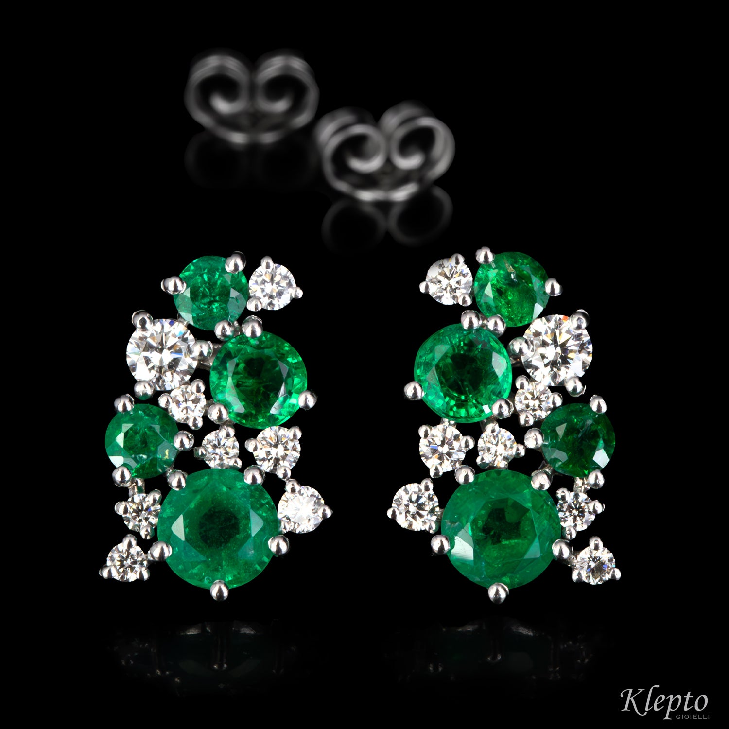 White gold earrings with emeralds and diamonds
