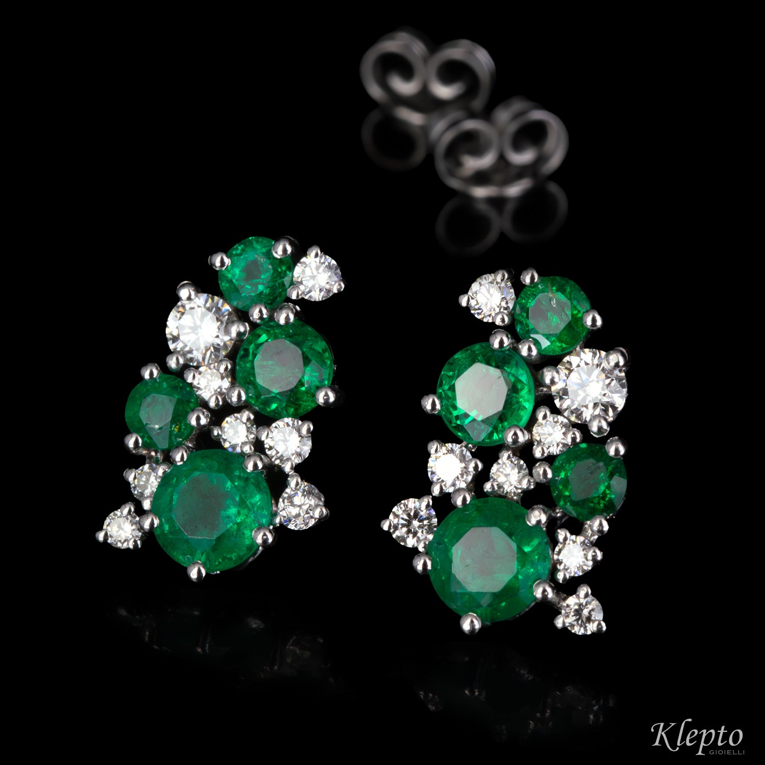 White gold earrings with emeralds and diamonds