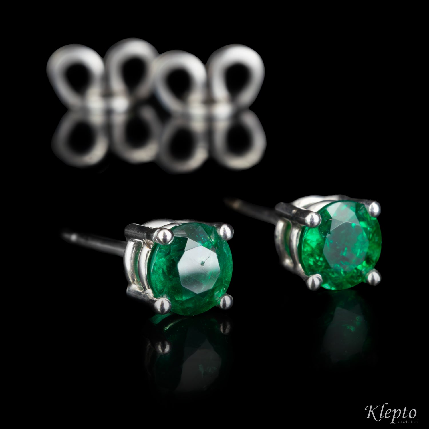 White gold earrings with emeralds