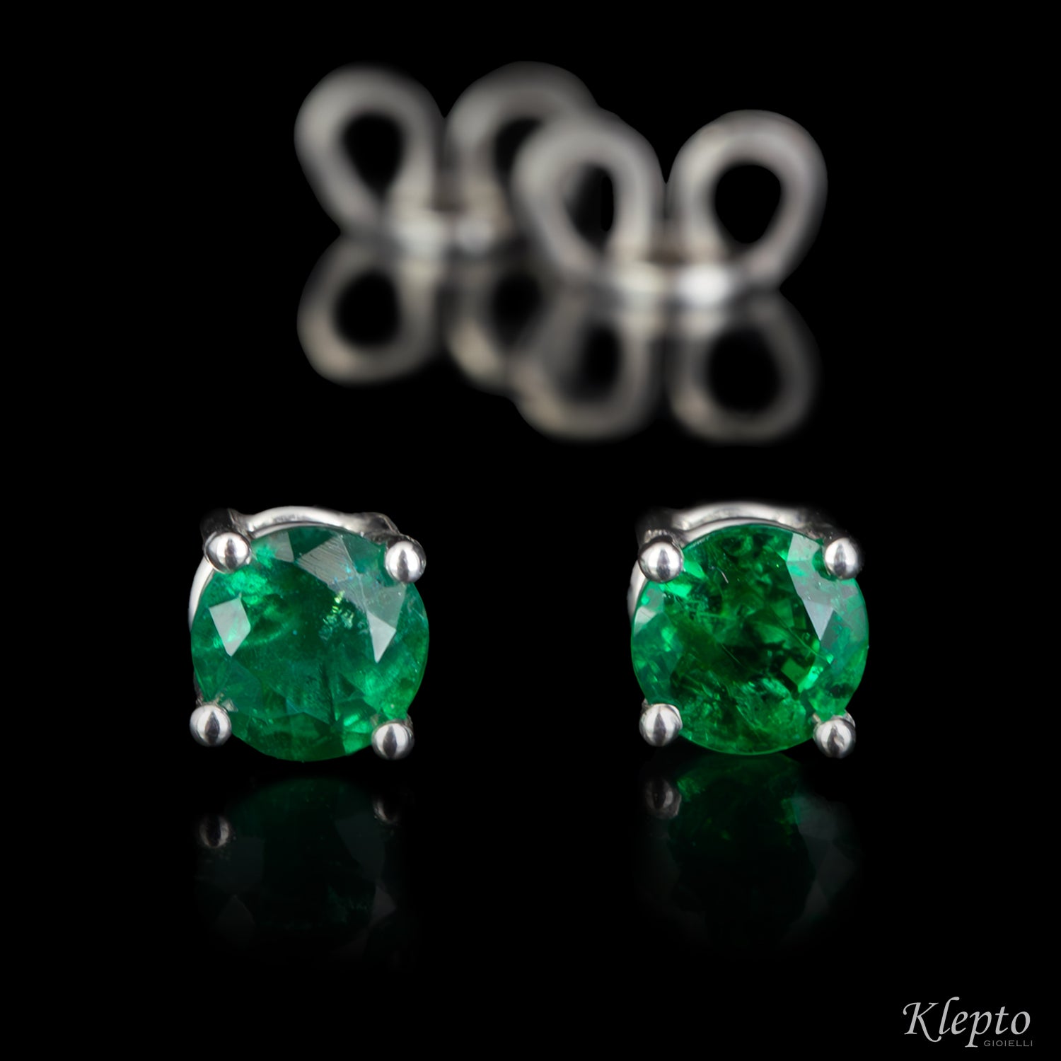 White gold earrings with emeralds