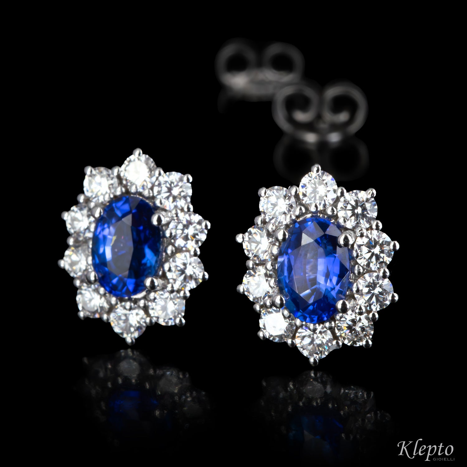 White gold stud earrings with blue sapphires and diamonds