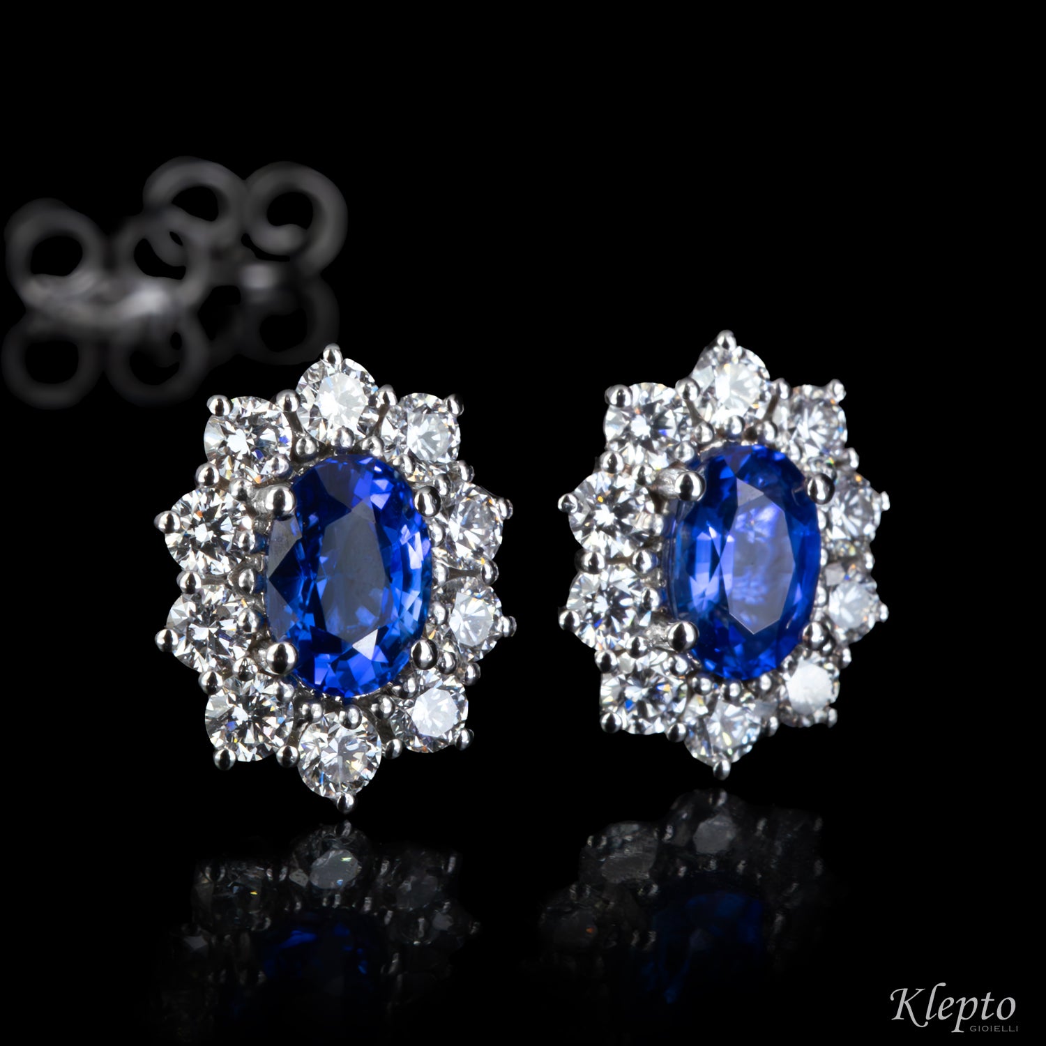 White gold stud earrings with blue sapphires and diamonds