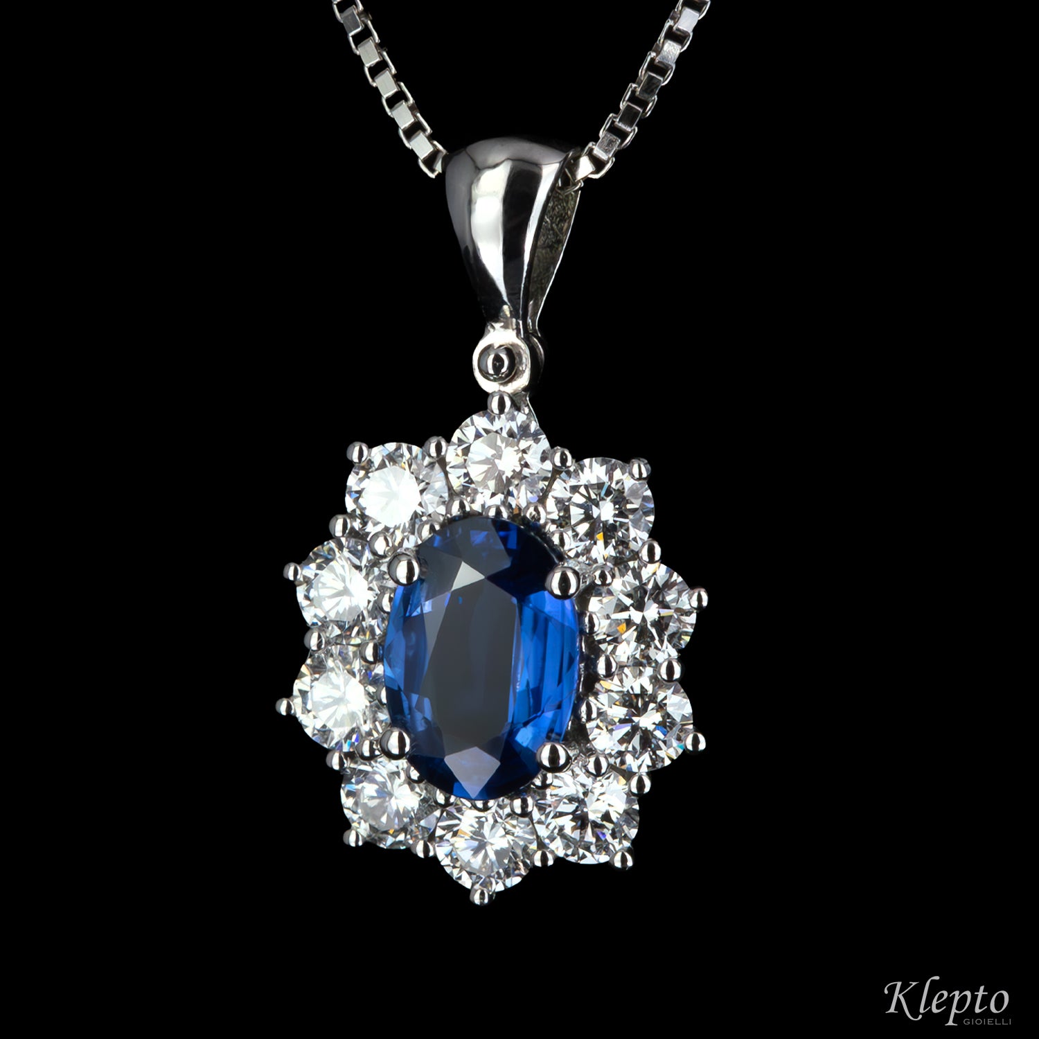 White gold pendant with Sapphire and diamond surround