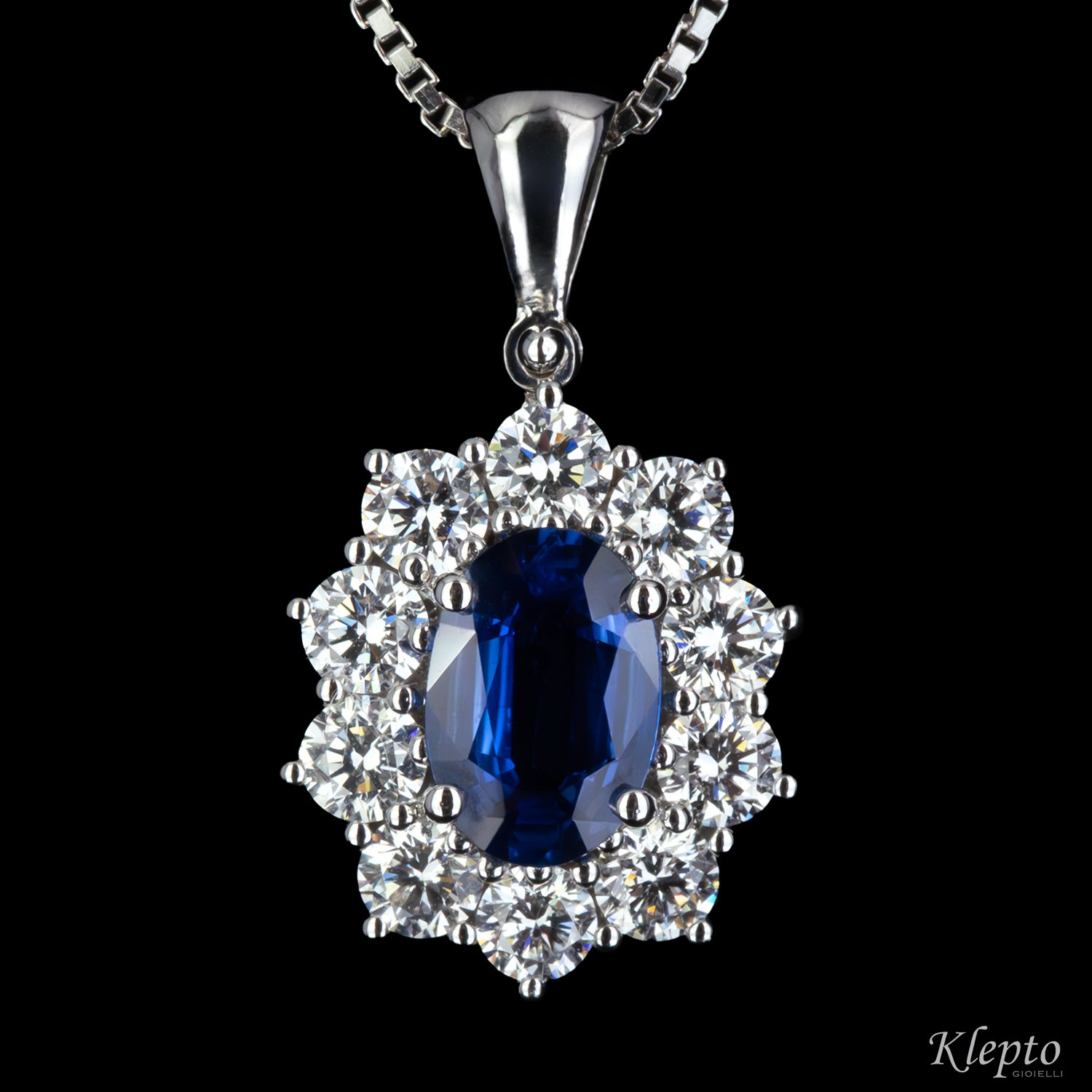 White gold pendant with Sapphire and diamond surround