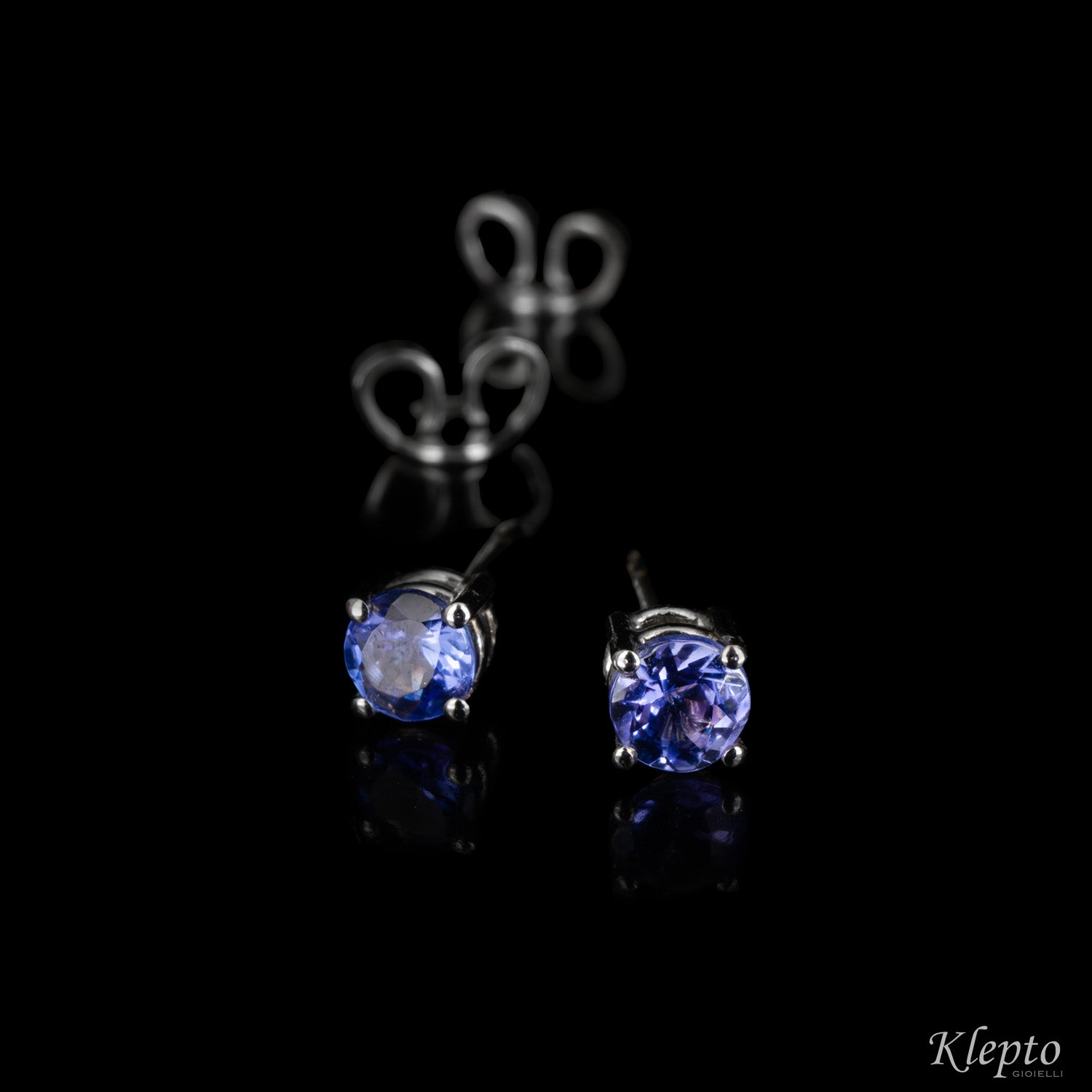 White gold earrings with light points with Tanzanites