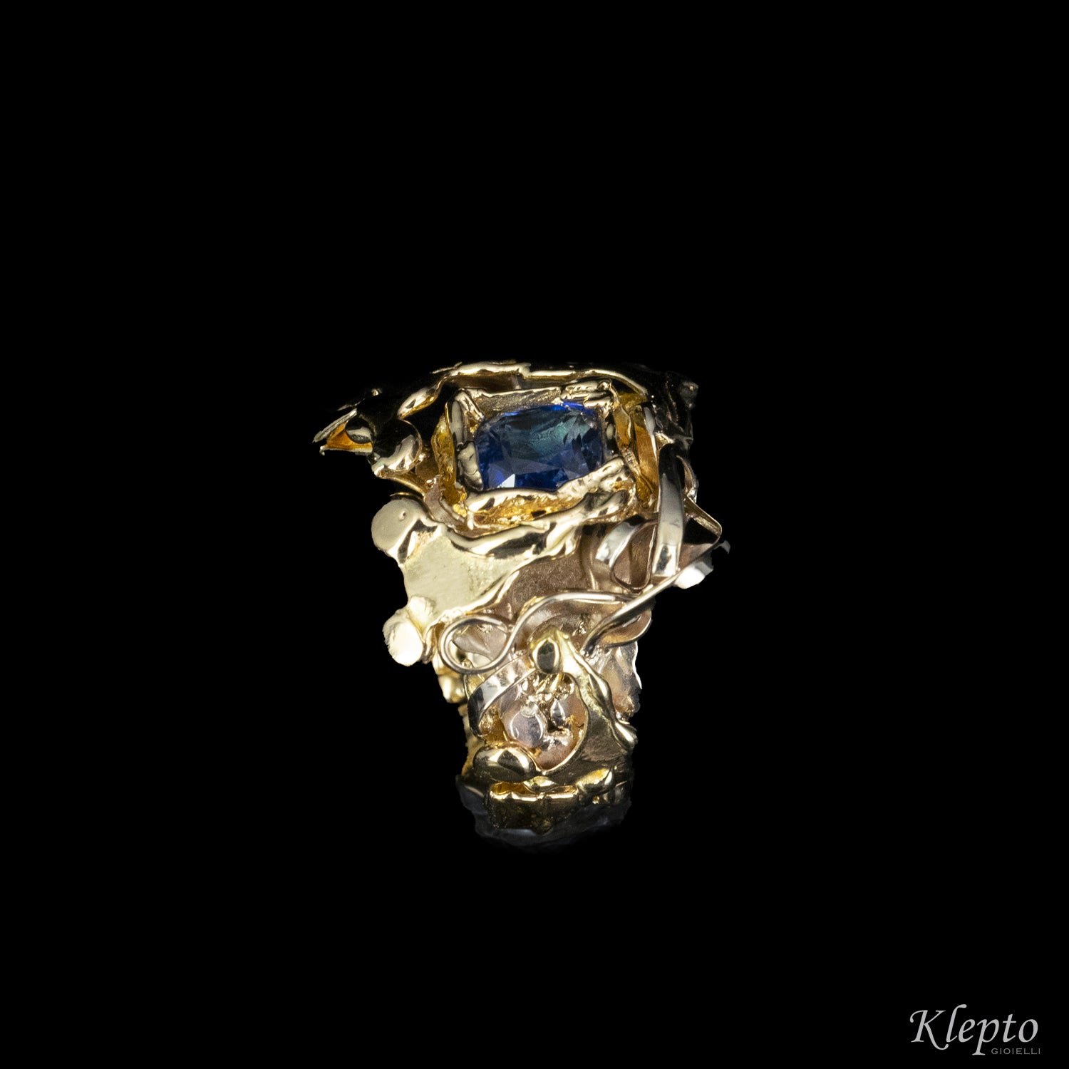 Ring in natural white gold, yellow gold and blue Sapphire