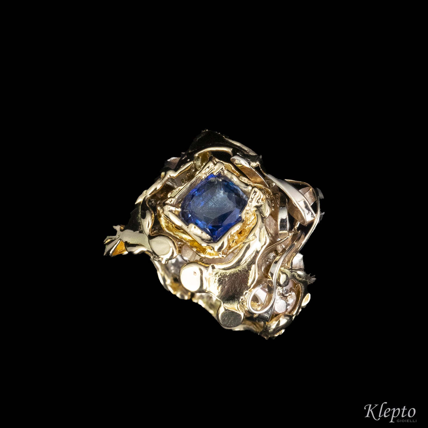 Ring in natural white gold, yellow gold and blue Sapphire