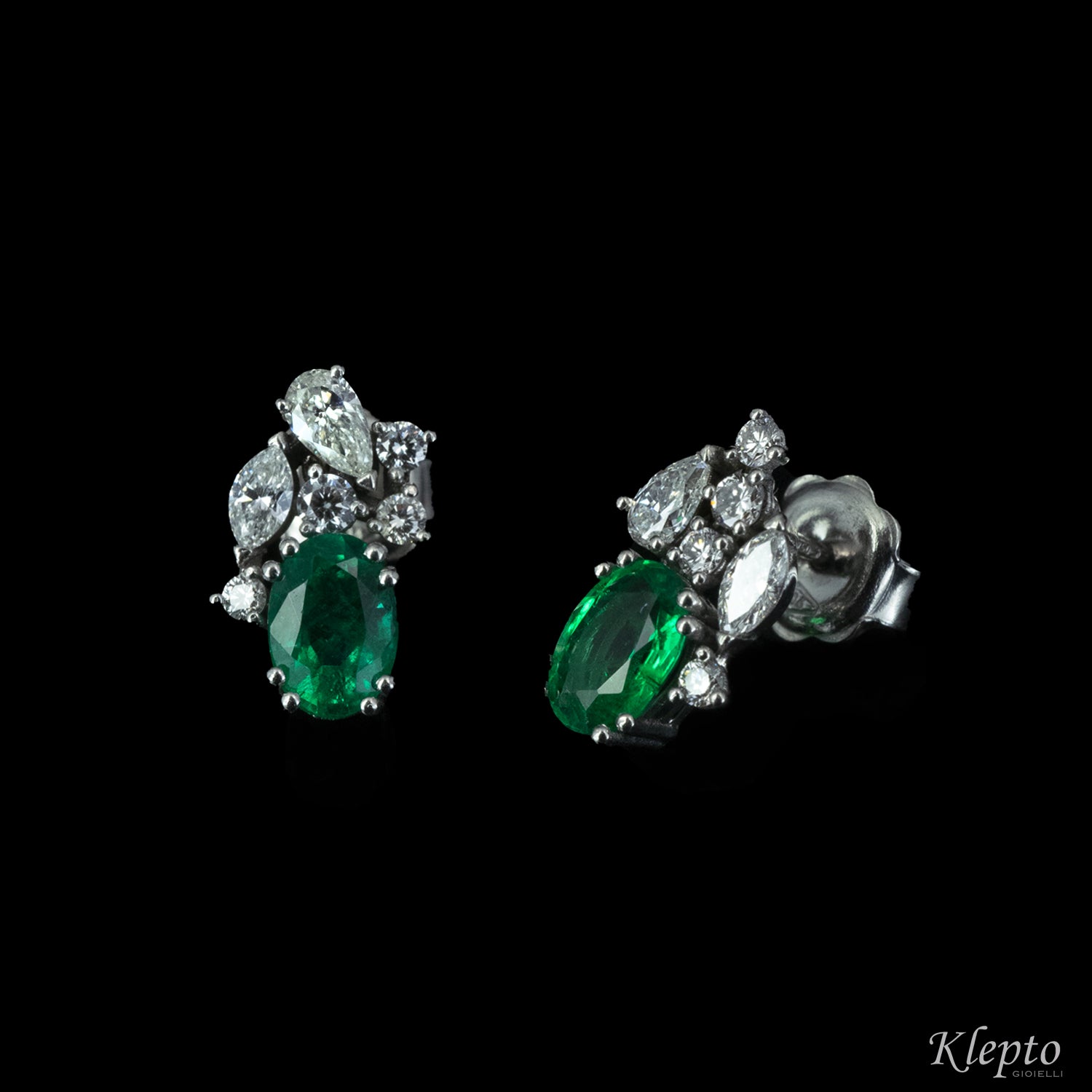 White gold earrings with emeralds and fancy cut diamonds
