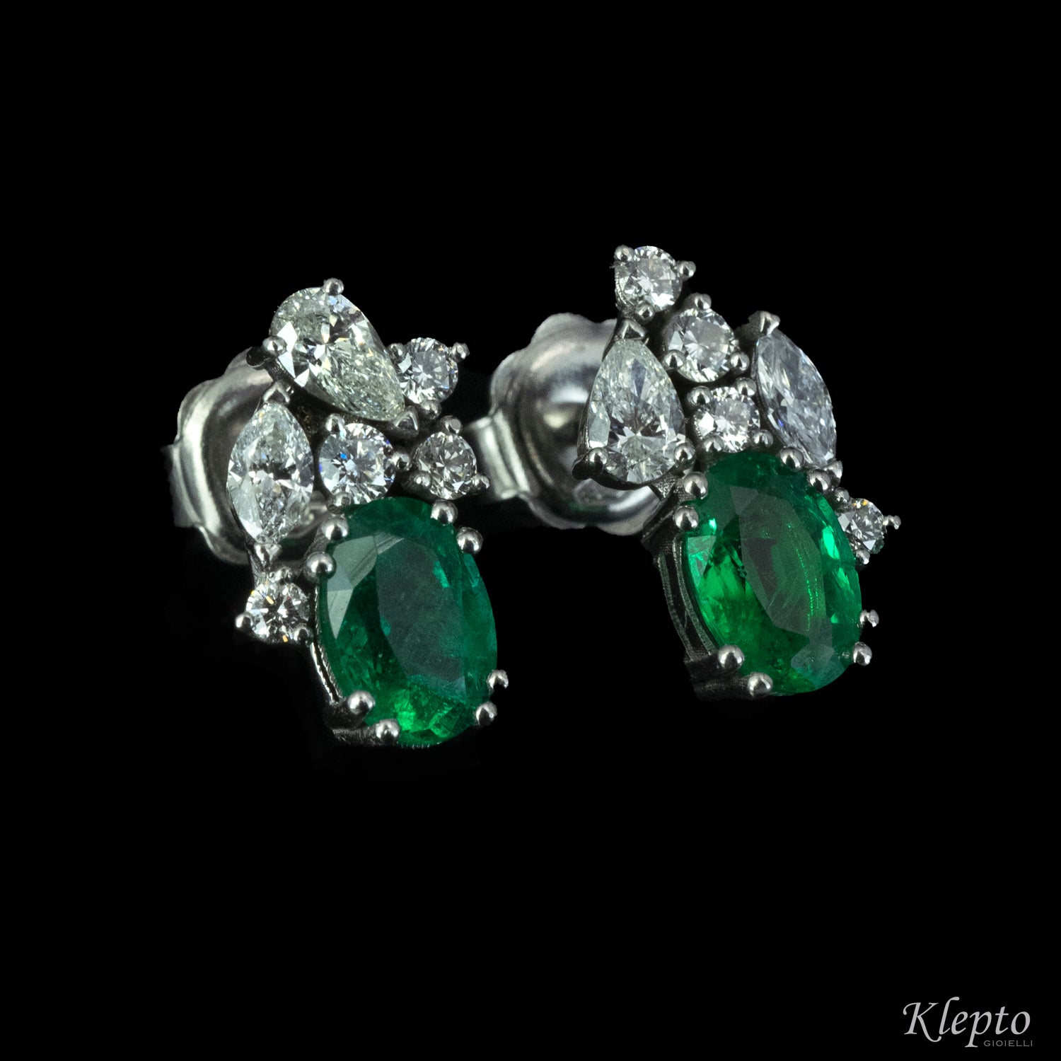 White gold earrings with emeralds and fancy cut diamonds