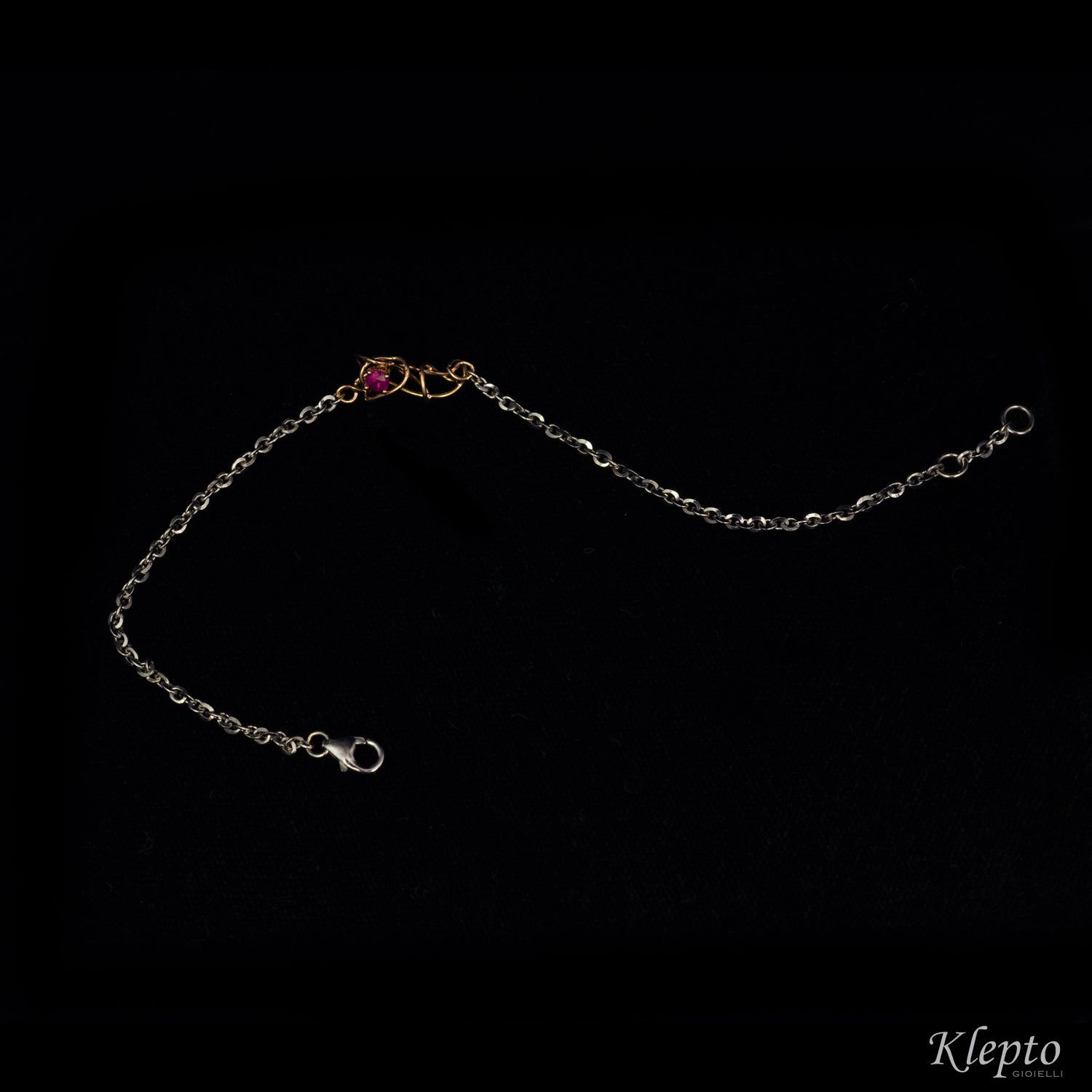 White gold bracelet with Ruby and rose gold knot